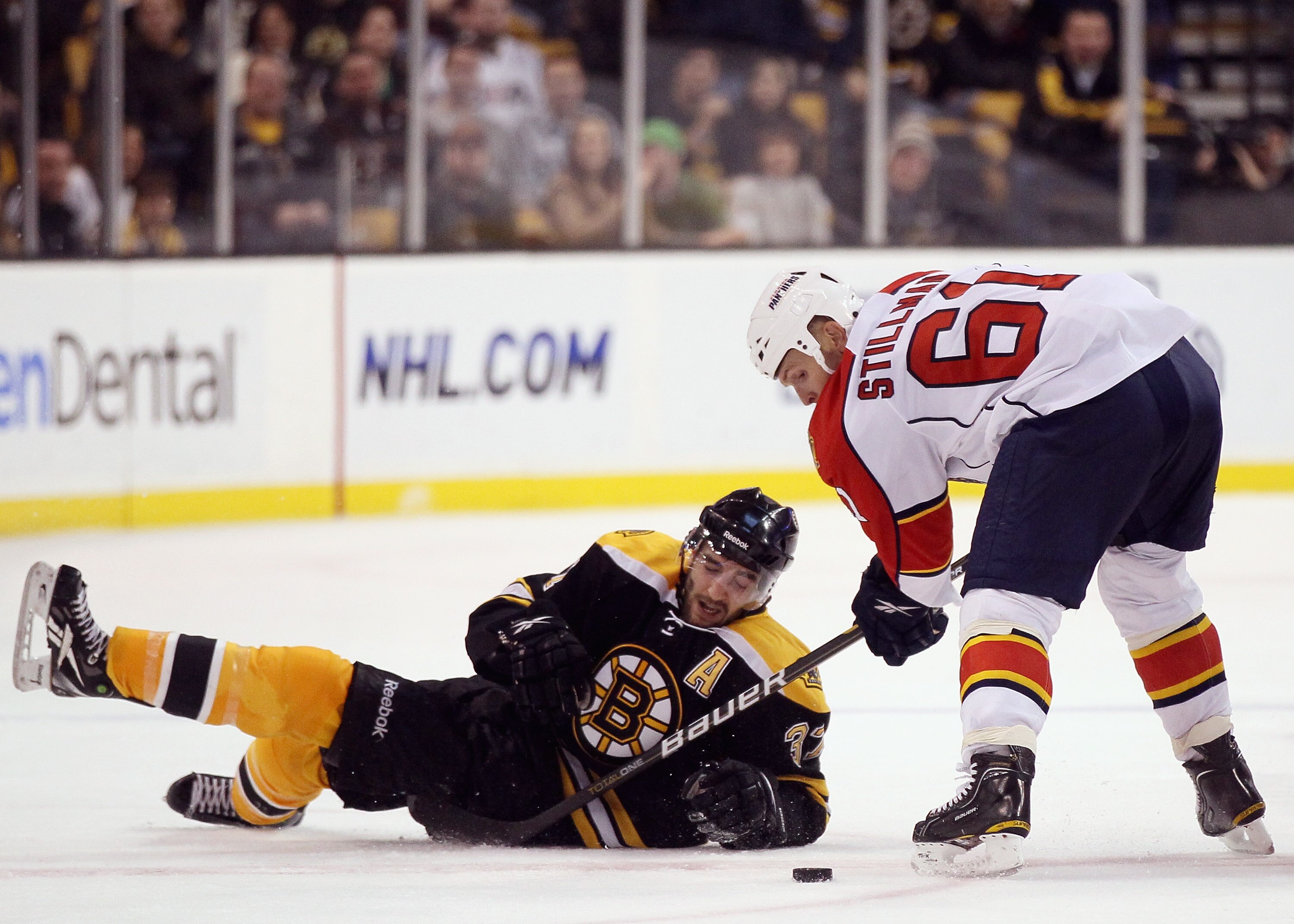BOSTON, MA - JANUARY 26:  Patrice Bergeron #37 of the Boston Bruins tries to keep the puck from Cory Stillman #61 of Florida Panthers on January 26, 2011 at the TD Garden in Boston, Massachusetts. The Bruins defeated the Panthers 2-1.  (Photo by Elsa/Gett