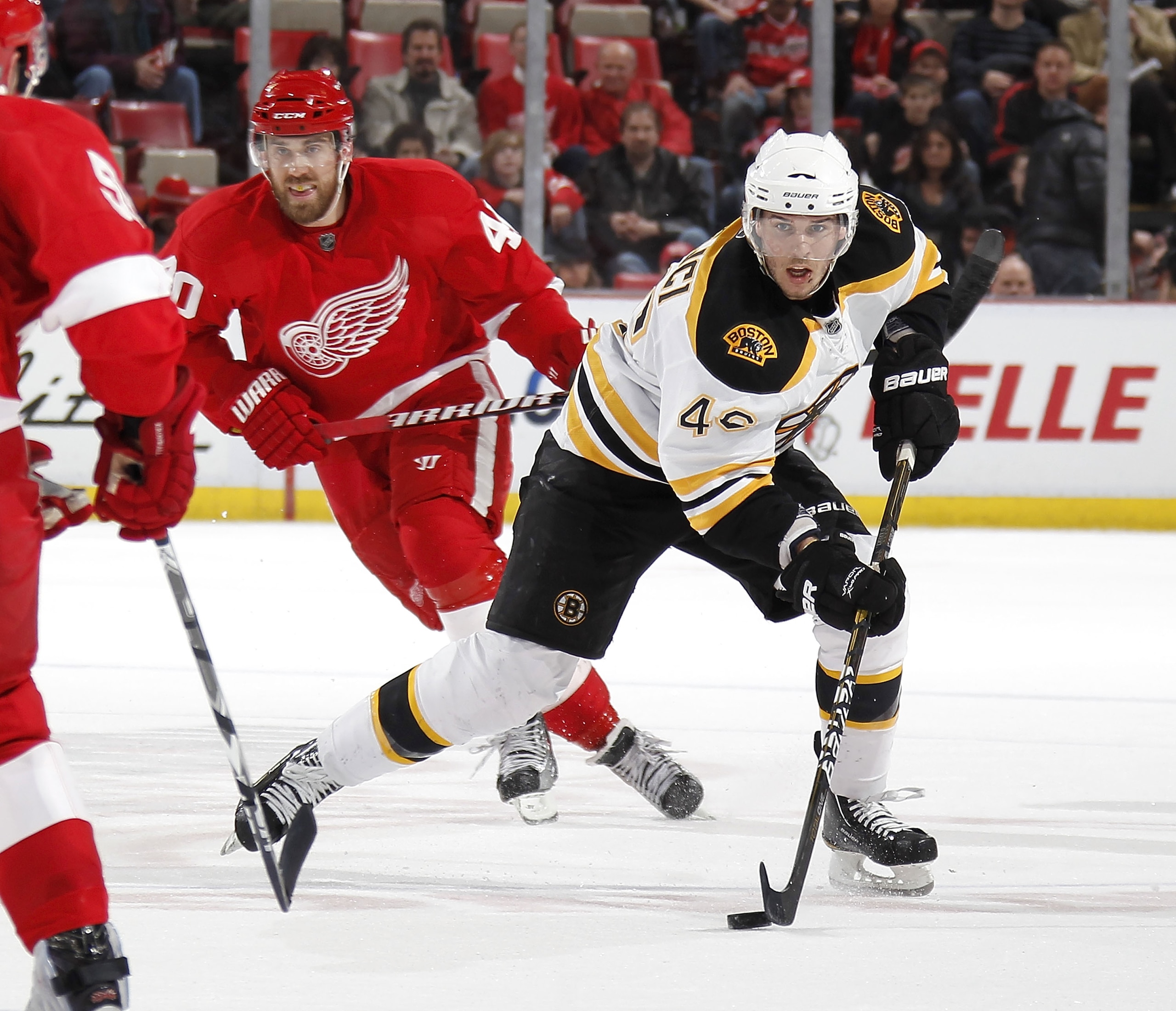 DETROIT, MI - FEBRUARY 13: David Krejci #46 of the Boston Bruins controls heads up ice in front of Henrik Zetterberg #40 of the of the Detroit Red Wings on February 13, 2011 at Joe Lewis Arena in Detroit, Michigan. Detroit won the game 4-2. (Photo by Gre DETROIT, MI - FEBRUARY 13: David Krejci #46 of the Boston Bruins controls heads up ice in front of Henrik Zetterberg #40 of the of the Detroit Red Wings on February 13, 2011 at Joe Lewis Arena in Detroit, Michigan. Detroit won the game 4-2. (Photo by Gre