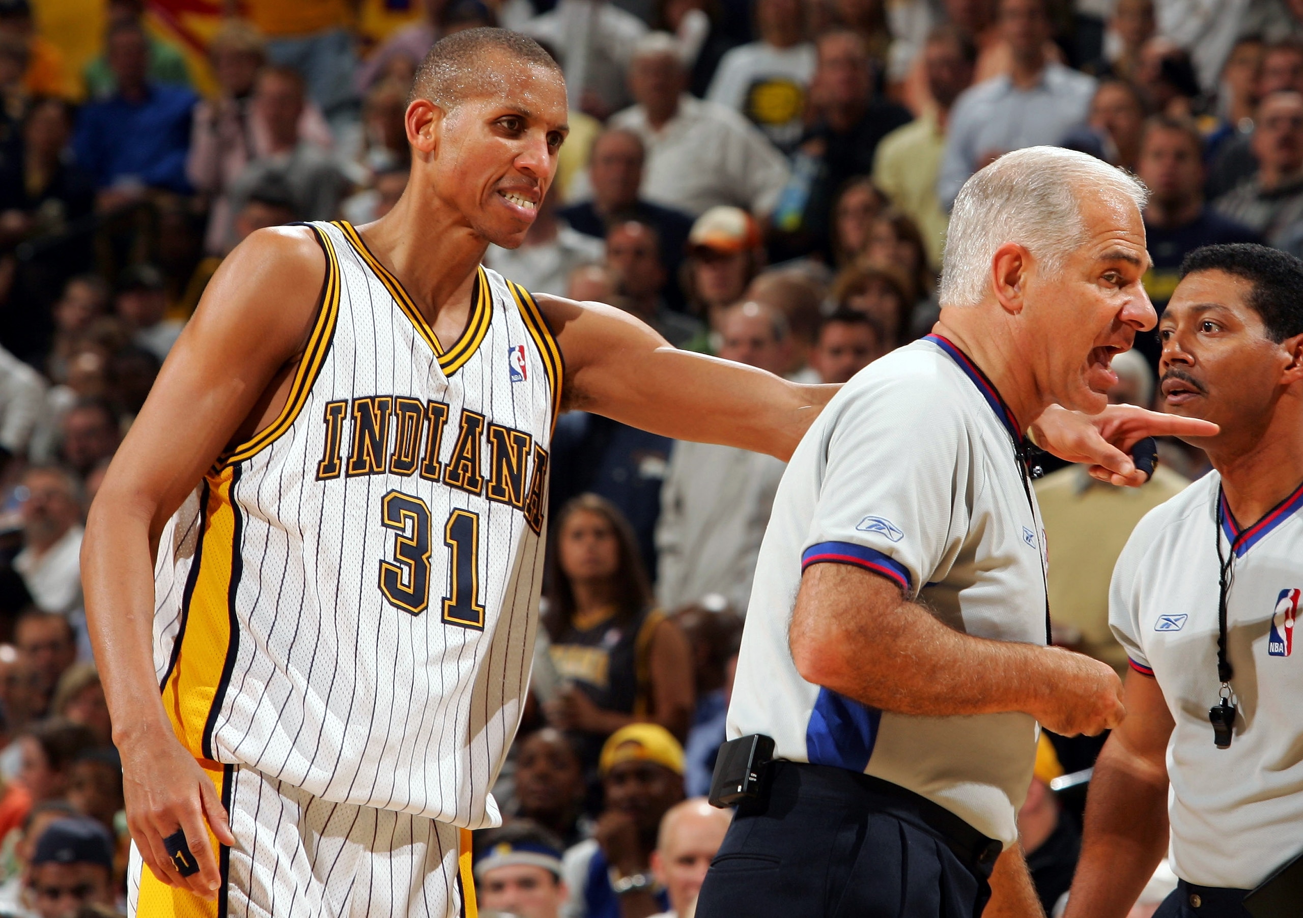 INDIANAPOLIS - APRIL 28: Reggie Miller #31 of the Indiana Pacers tries to stick up for teammate Jermaine O'Neal to referee Bennett Salvatore #15 in Game three of the Eastern Conference Quarterfinals during the 2005 NBA Playoffs on April 28, 2005 at Consec