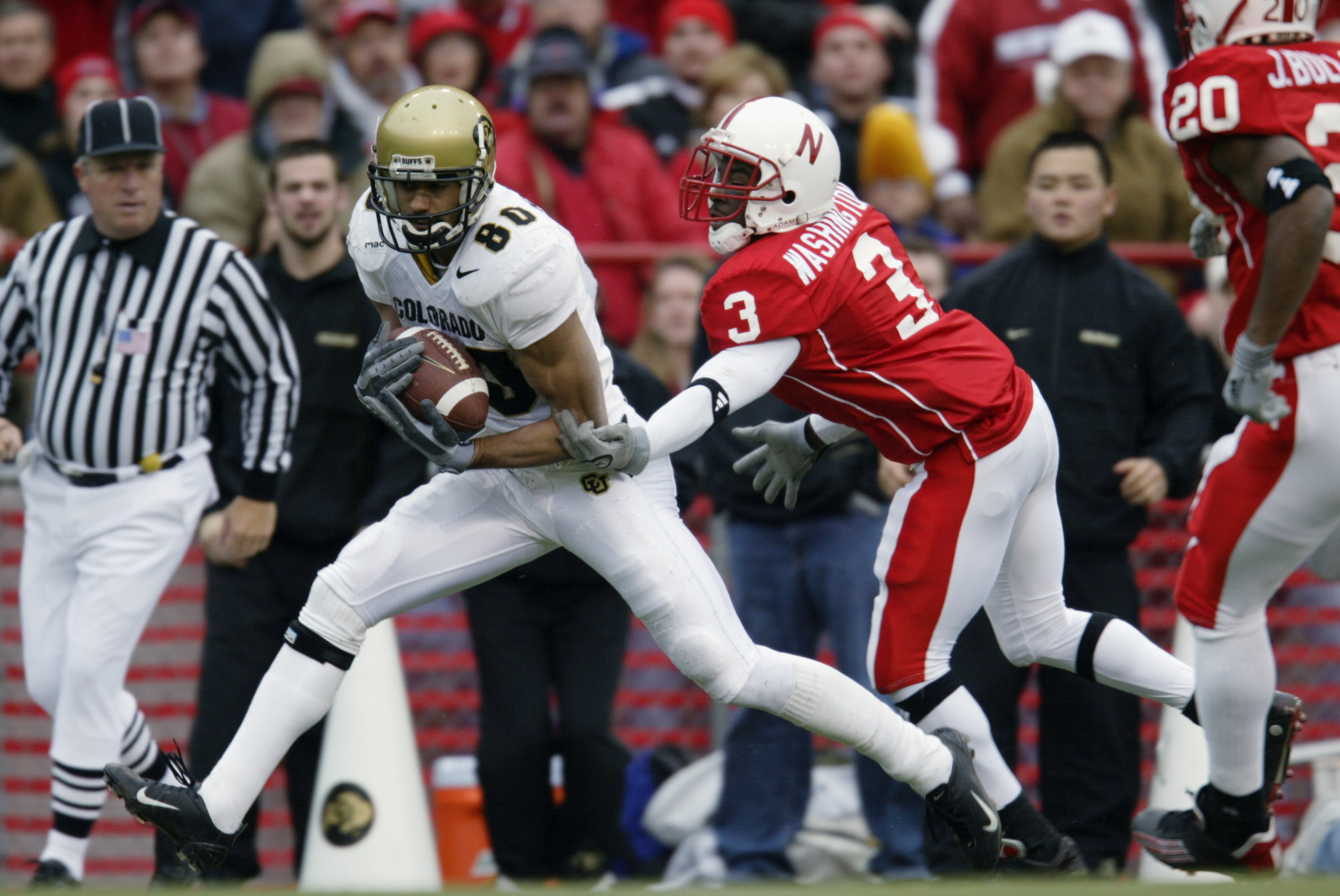 LINCOLN, NE - NOVEMBER 29:  Wide receiver Derek McCoy #80 of the University of Colorado Buffaloes pulls down a 40-yard touchdown pass against cornerback Fabian Washington #3 of the University of Nebraska Cornhuskers in the first quarter of the NCAA game a