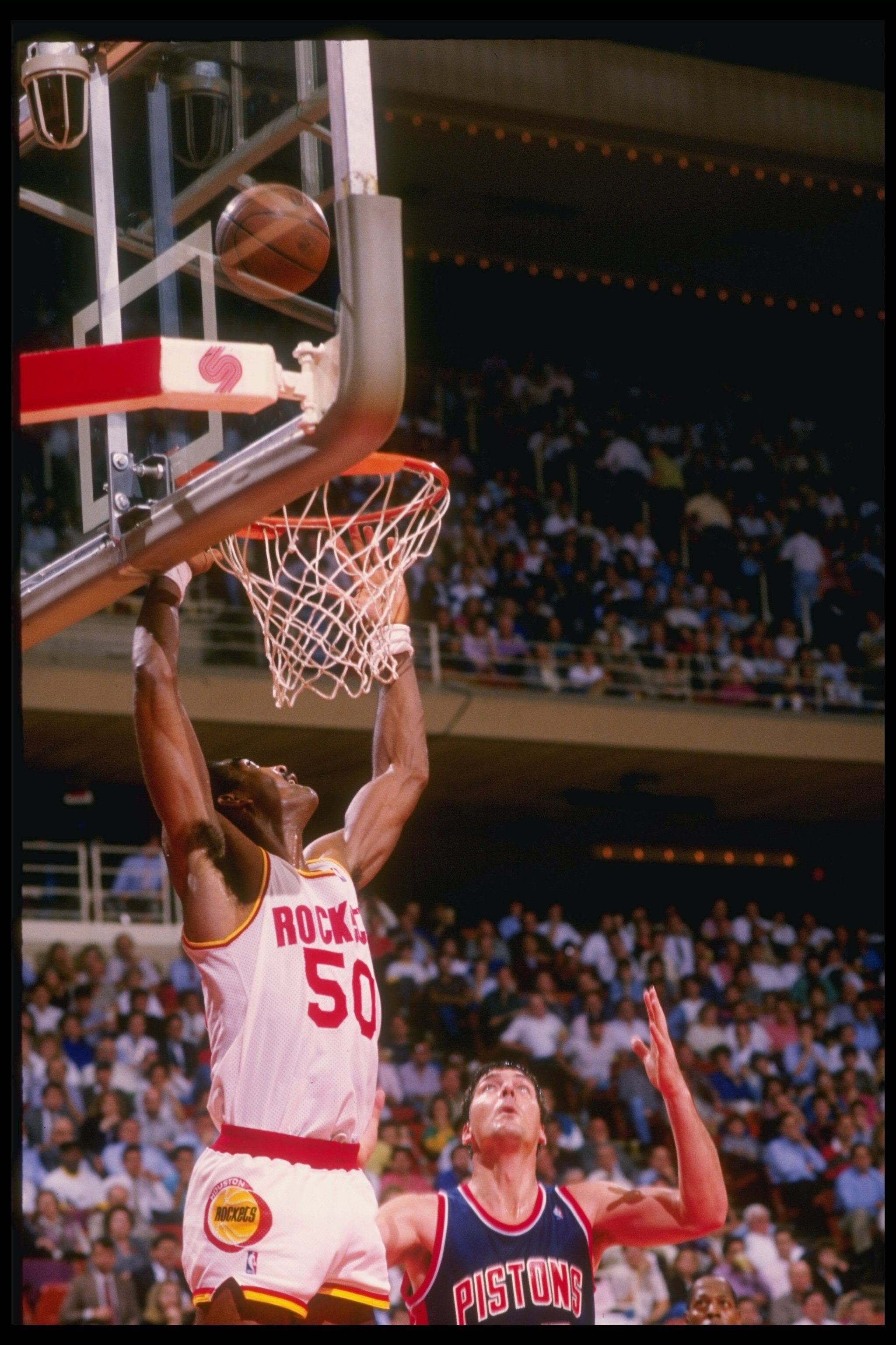 Undated:  Center Ralph Sampson of the Houston Rockets (left) in action against center Bil Laimbeer of the Detroit Pistons during a game at The Summit in Houston, Texas. Mandatory Credit: Allsport  /Allsport