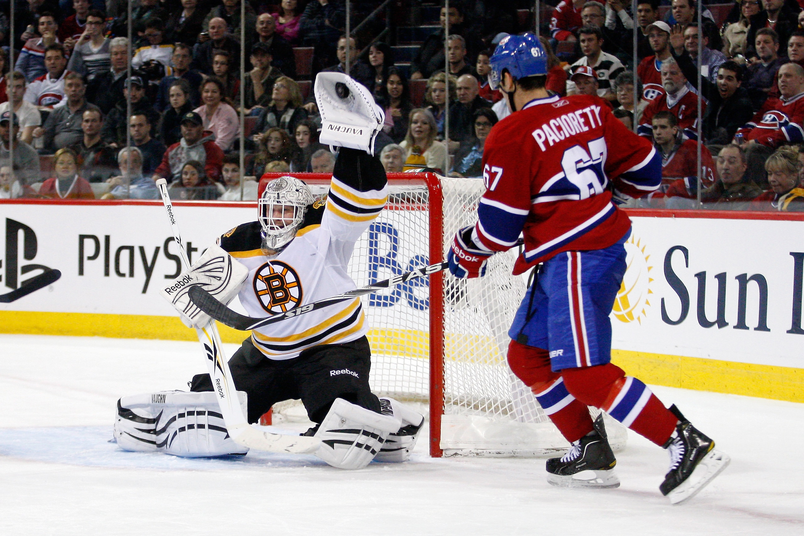 MONTREAL, CANADA - JANUARY 8: Tim Thomas #30 of the Boston Bruins makes a glove save on the puck in front of Max Pacioretty #67 of the Montreal Canadiens during the NHL game at the Bell Centre on January 8, 2011 in Montreal, Quebec, Canada. (Photo by Ri MONTREAL, CANADA - JANUARY 8: Tim Thomas #30 of the Boston Bruins makes a glove save on the puck in front of Max Pacioretty #67 of the Montreal Canadiens during the NHL game at the Bell Centre on January 8, 2011 in Montreal, Quebec, Canada. (Photo by Ri