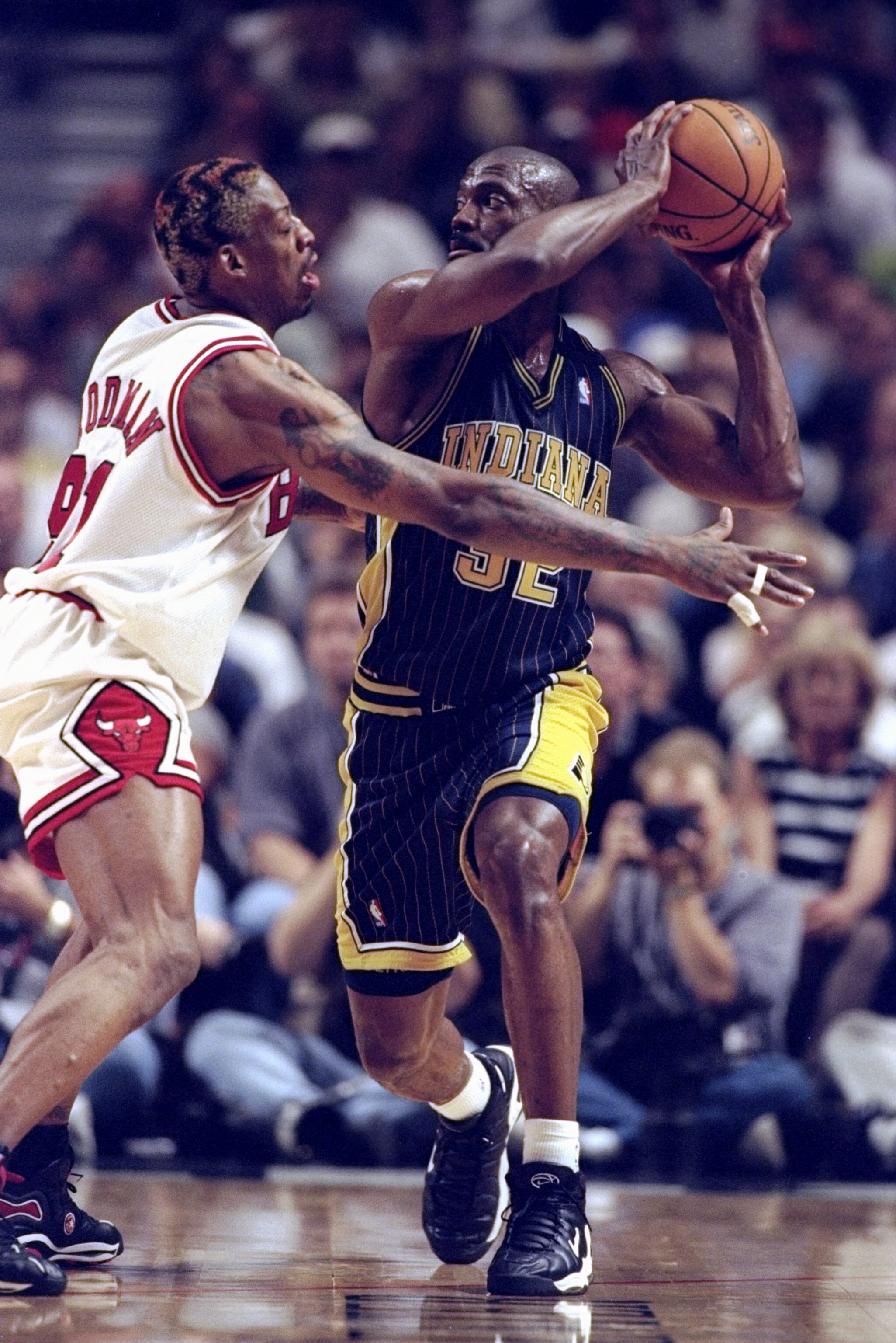 31 May 1998: Dale Davis #32 of the Indiana Pacers is guarded by Dennis Rodman #91 of the Chicago Bulls during game seven of the Eastern Conference Finals at the United Center in Chicago, Illinois. The Bulls defeated the Pacers 88-83.