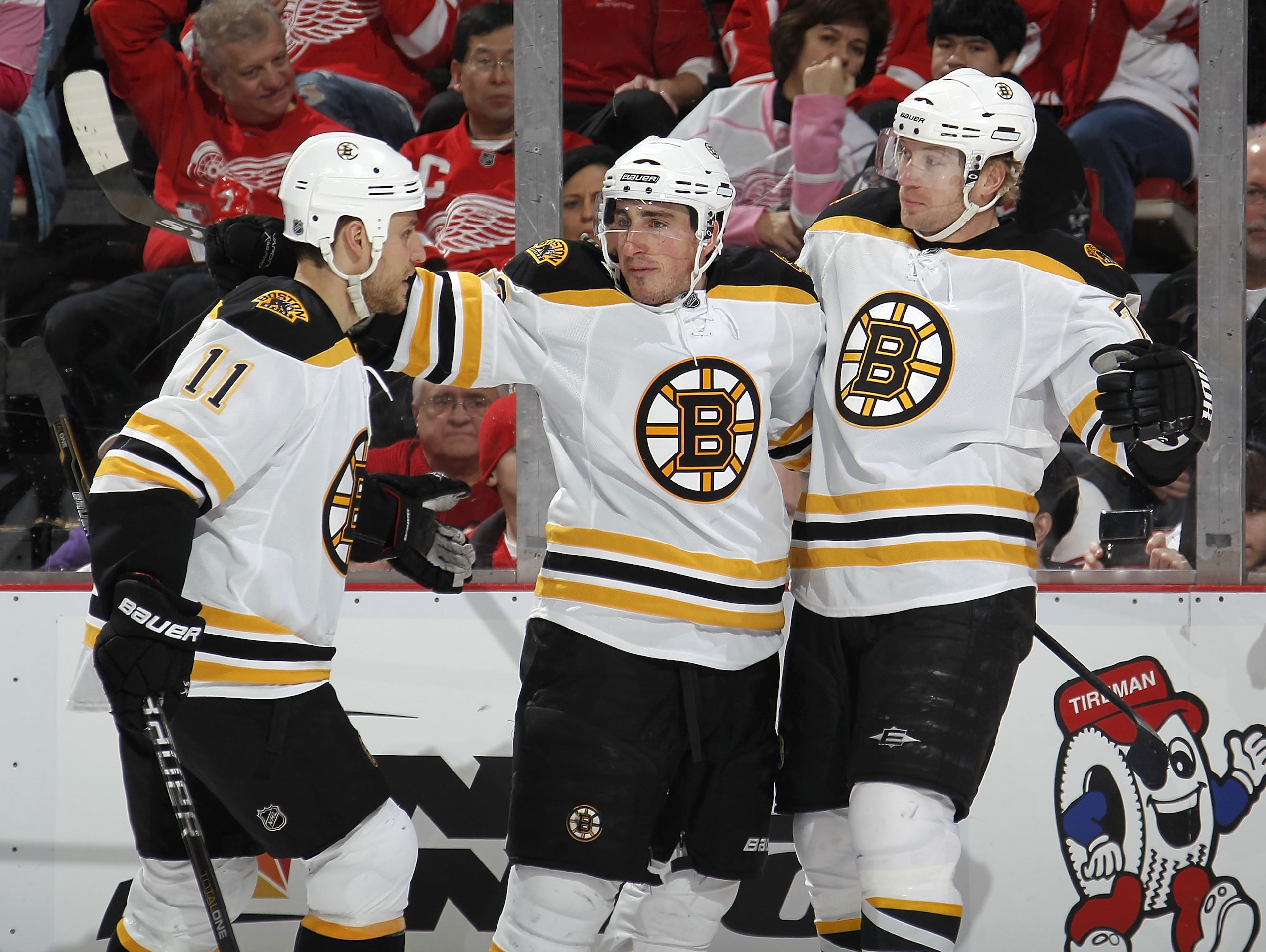 DETROIT, MI - FEBRUARY 13: Brad Marchand #63 of the Boston Bruins celebrates a first period goal with Michael Ryder #73 and Gregory Campbell #11 while playing the Detroit Red Wings on February 13, 2011 at Joe Lewis Arena in Detroit, Michigan. (Photo by DETROIT, MI - FEBRUARY 13: Brad Marchand #63 of the Boston Bruins celebrates a first period goal with Michael Ryder #73 and Gregory Campbell #11 while playing the Detroit Red Wings on February 13, 2011 at Joe Lewis Arena in Detroit, Michigan. (Photo by