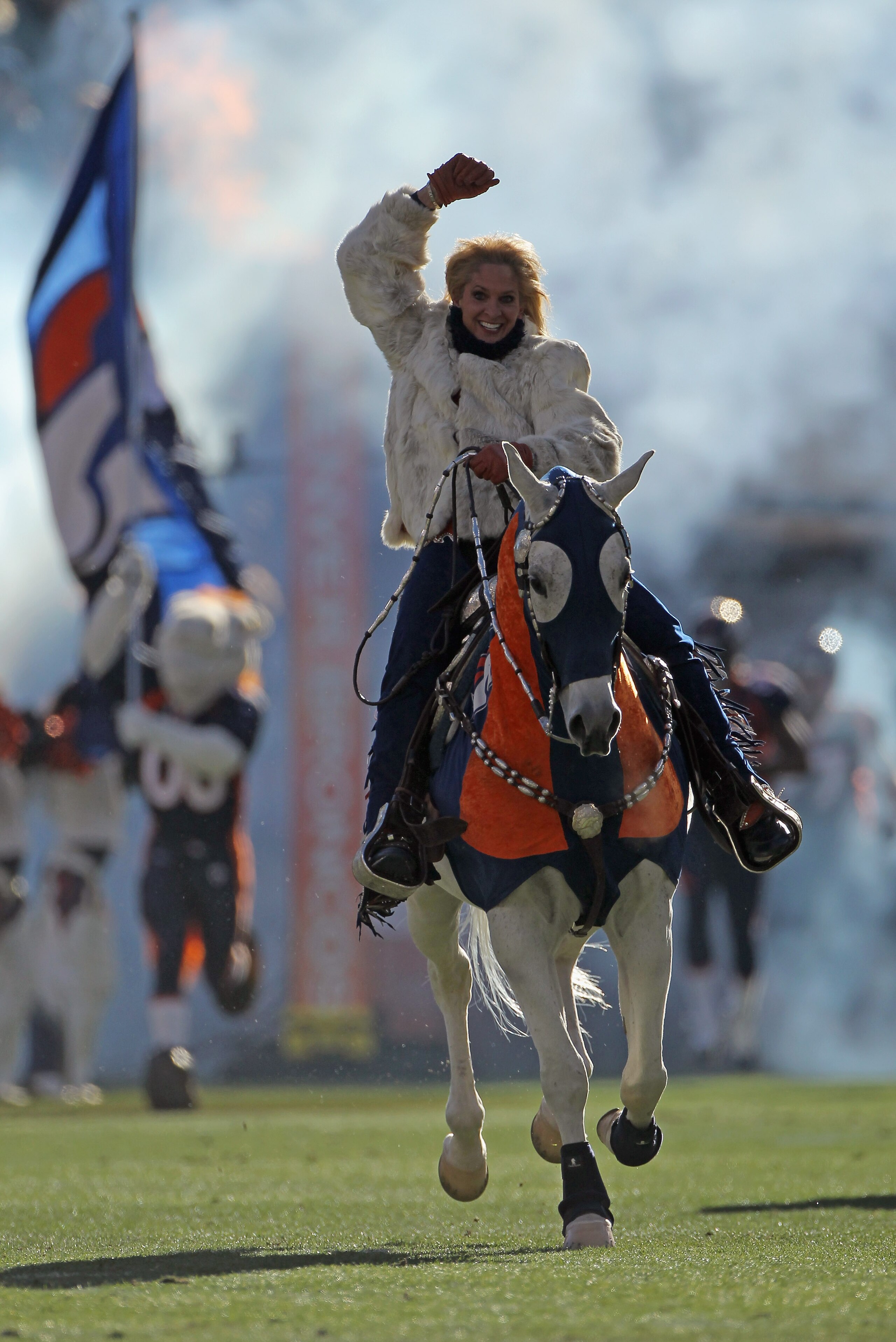 DENVER - JANUARY 02:  Ann Judge-Wegener rides Thunder onto the field as the Denver Broncos prepare to face the San Diego Chargers at INVESCO Field at Mile High on January 2, 2011 in Denver, Colorado. The Chargers defeated the Broncos 33-28.  (Photo by Dou