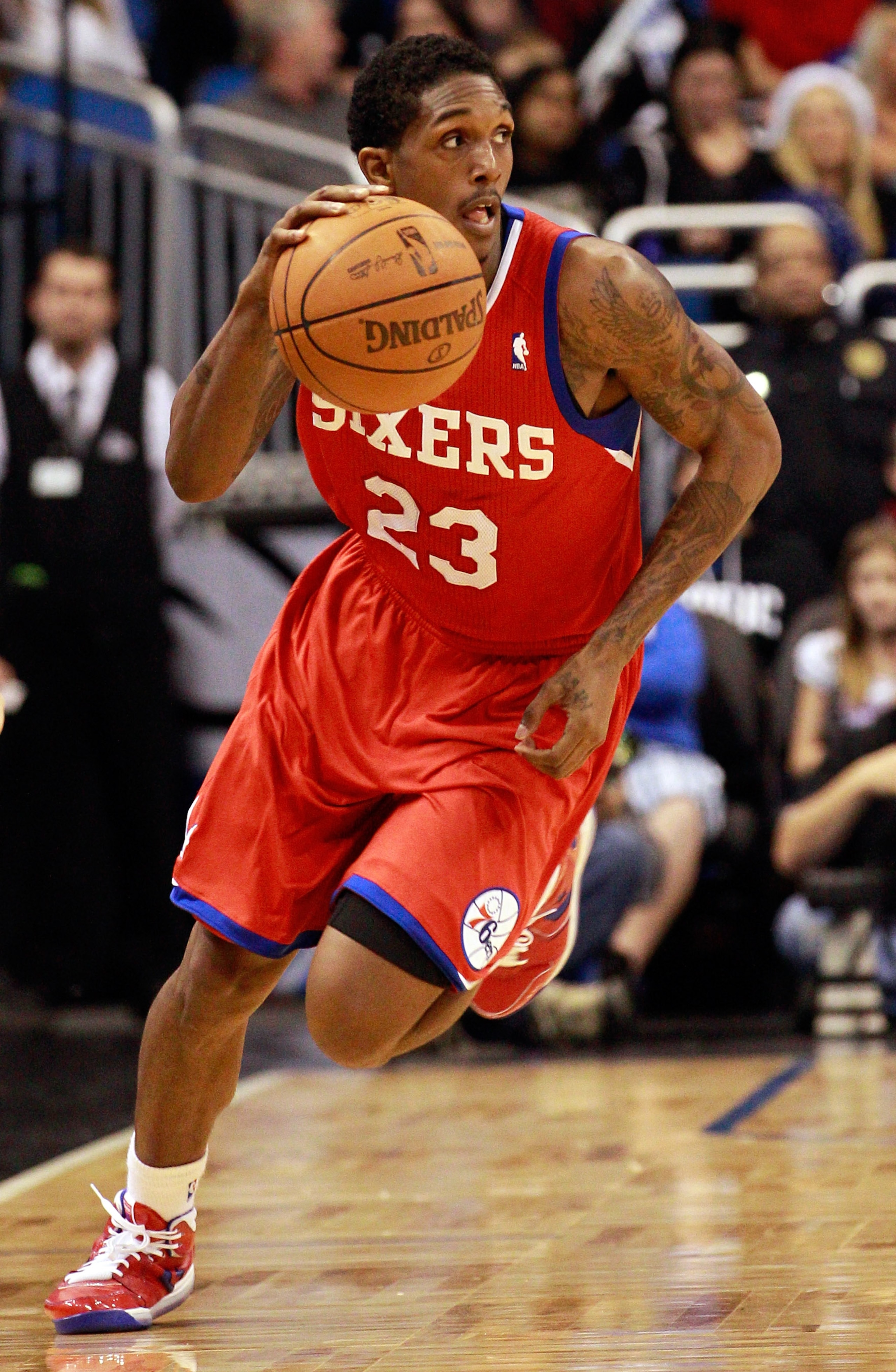 ORLANDO, FL - DECEMBER 18:  Louis Williams #23 of the Philadelphia 76ers brings the ball up the court during the game against the Orlando Magic at Amway Arena on December 18, 2010 in Orlando, Florida.  NOTE TO USER: User expressly acknowledges and agrees