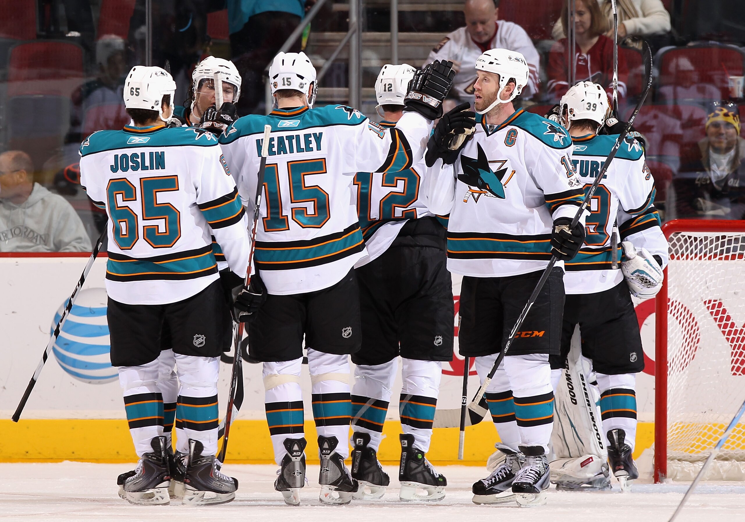 GLENDALE, AZ - JANUARY 17:  Joe Thornton #19 of the San Jose Sharks celebrates with teammates after the NHL game against the Phoenix Coyotes at Jobing.com Arena on January 17, 2011 in Glendale, Arizona.  The Sharks defeated the Coyotes 4-2.  (Photo by Chr