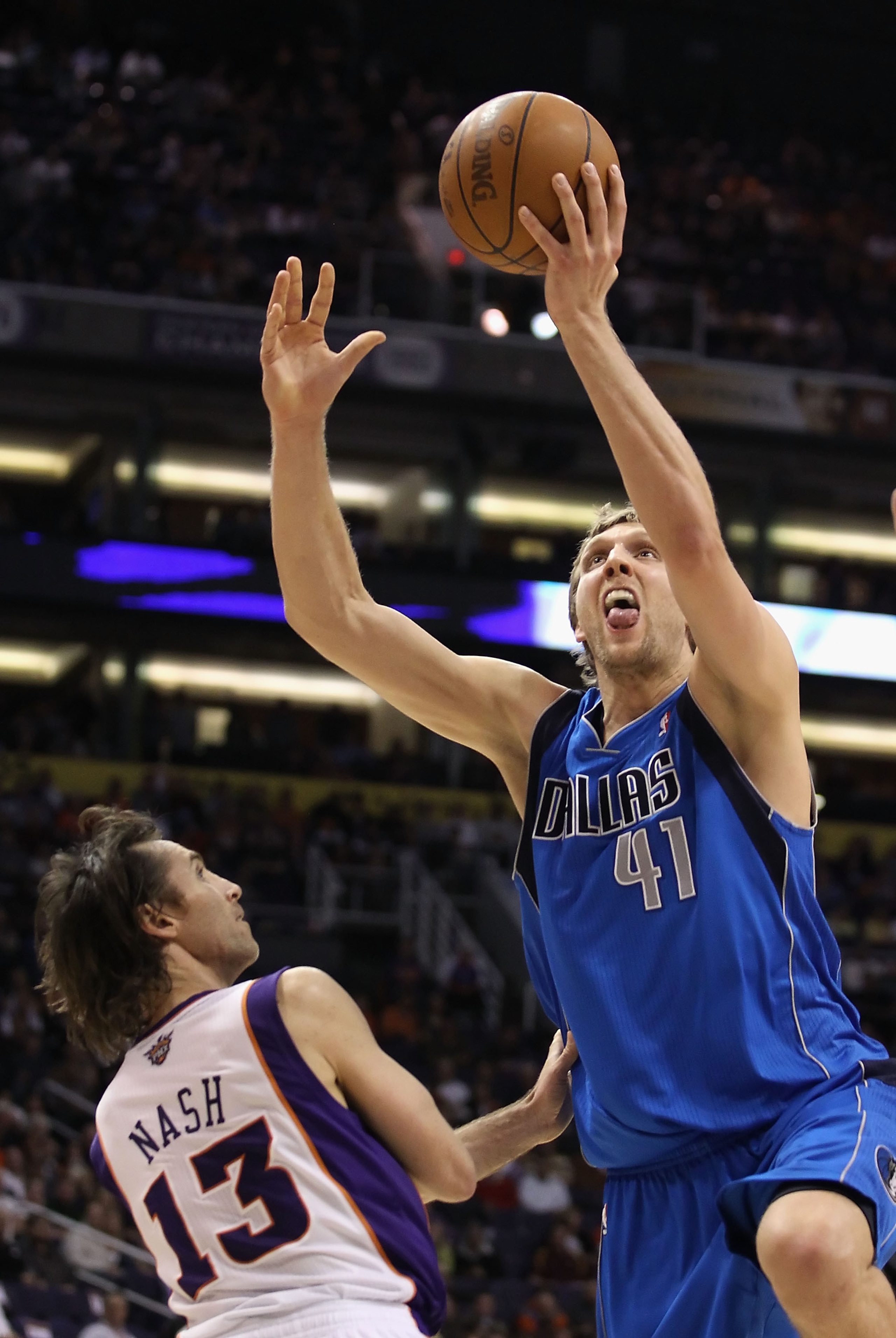 PHOENIX, AZ - FEBRUARY 17:  Dirk Nowitzki #41 of the Dallas Mavericks puts up a shot over Steve Nash #13 of the Phoenix Suns during the NBA game at US Airways Center on February 17, 2011 in Phoenix, Arizona.  The Mavericks defeated the Suns 112-106. NOTE