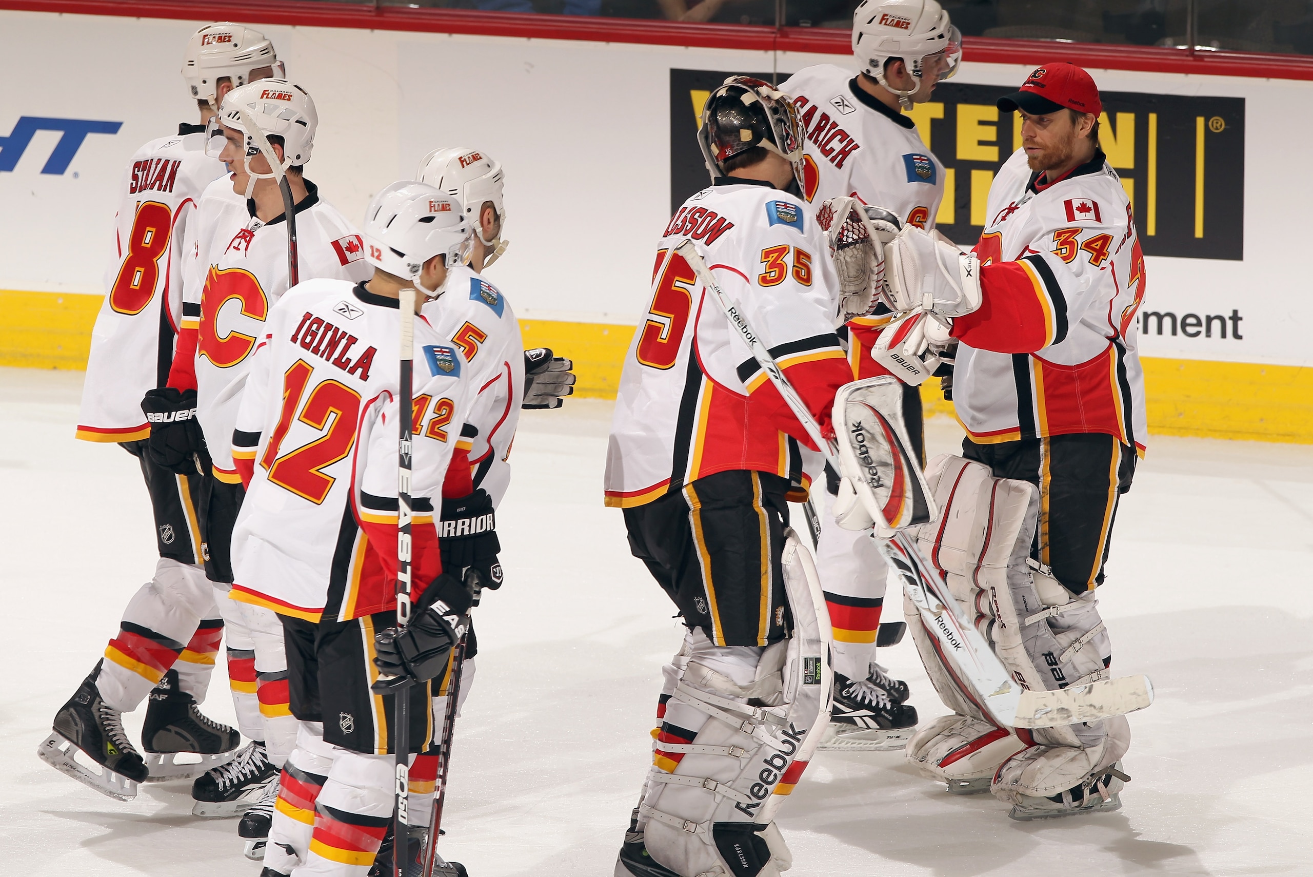 DENVER, CO - FEBRUARY 14:  The Calgary Flames celebrate their victory over the Colorado Avalanche defends at the Pepsi Center on February 14, 2011 in Denver, Colorado. The Flames defeated the Avalanche 9-1.  (Photo by Doug Pensinger/Getty Images)