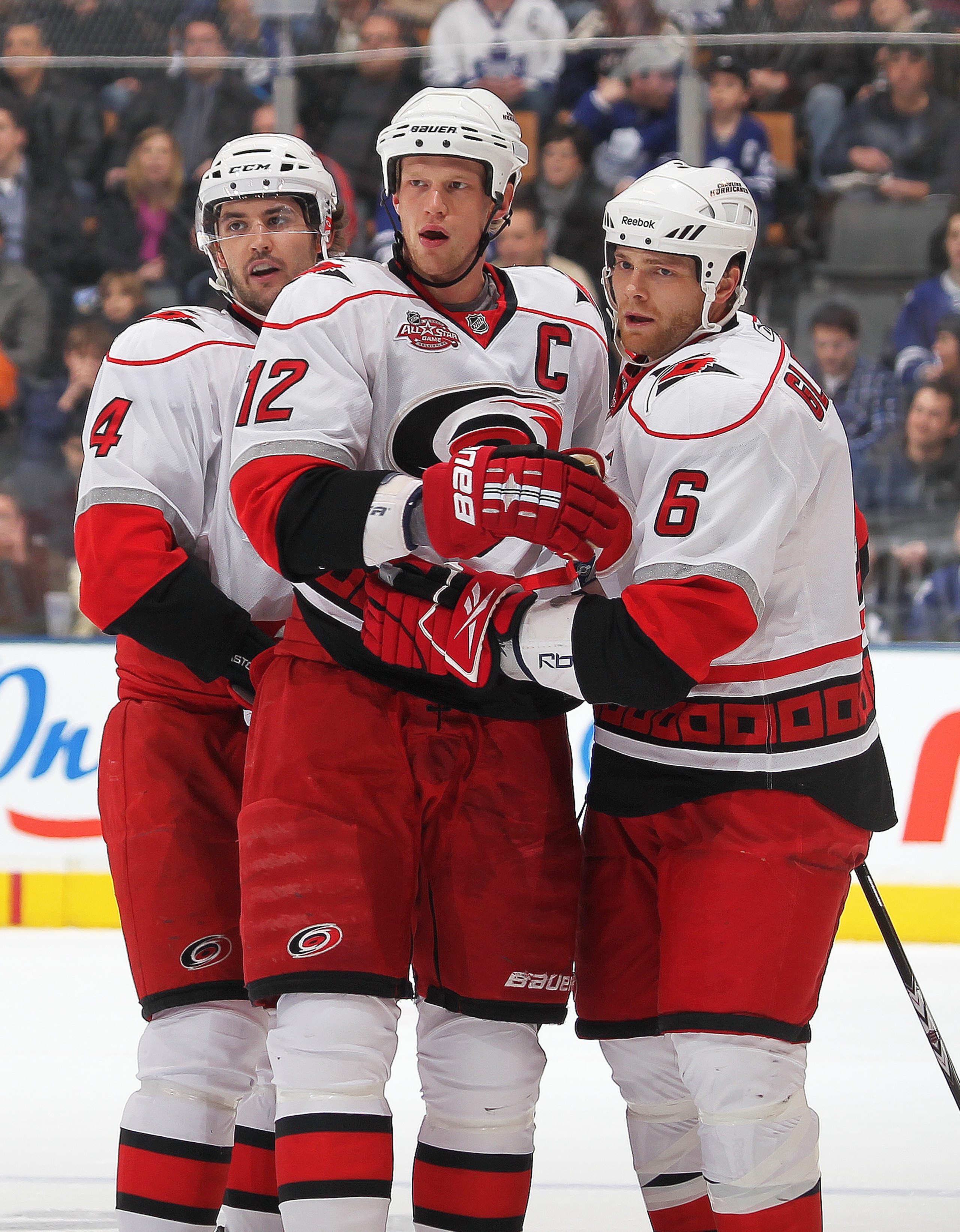 TORONTO,ON - DECEMBER 28:  Eric Staal #12 of the Carolina Hurricanes receives congratulations from his teammates after scoring his second goal in a game against the Toronto Maple Leafs on December 28, 2010 at the Air Canada Centre in Toronto, Ontario. (Ph