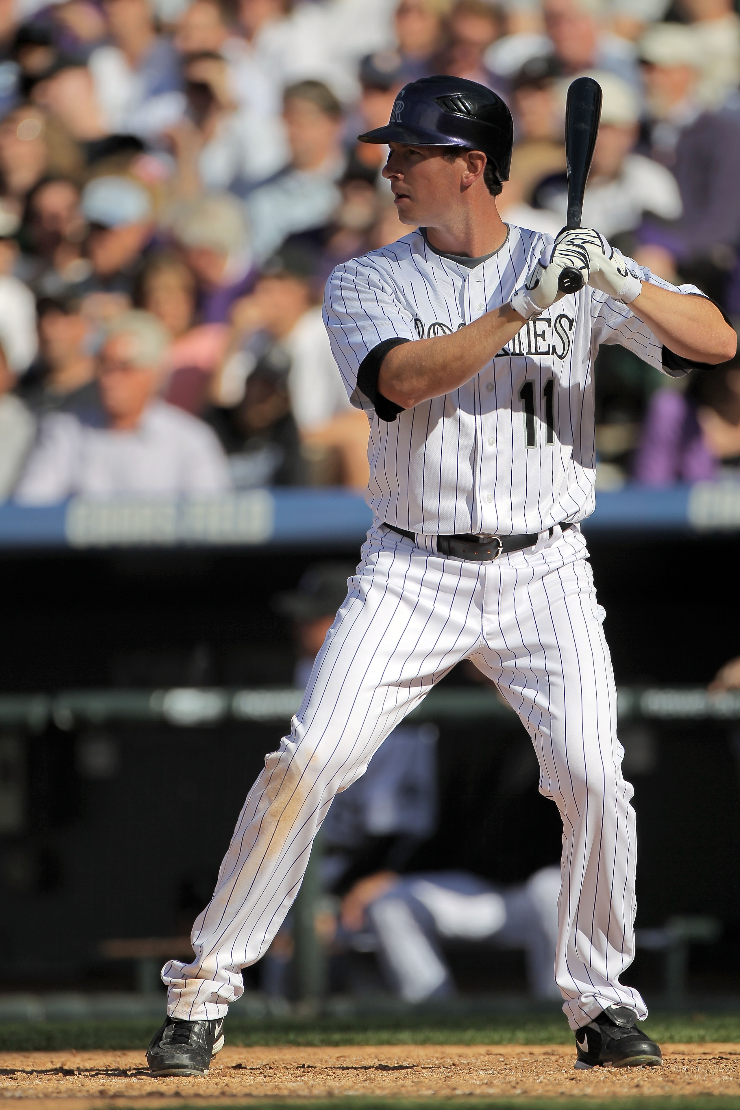 DENVER - APRIL 09:  Brad Hawpe #11 of the Colorado Rockies takes an at bat against the San Diego Padres during MLB action on Opening Day at Coors Field on April 9, 2010 in Denver, Colorado. The Rockies defeated the Padres 7-0.  (Photo by Doug Pensinger/Ge