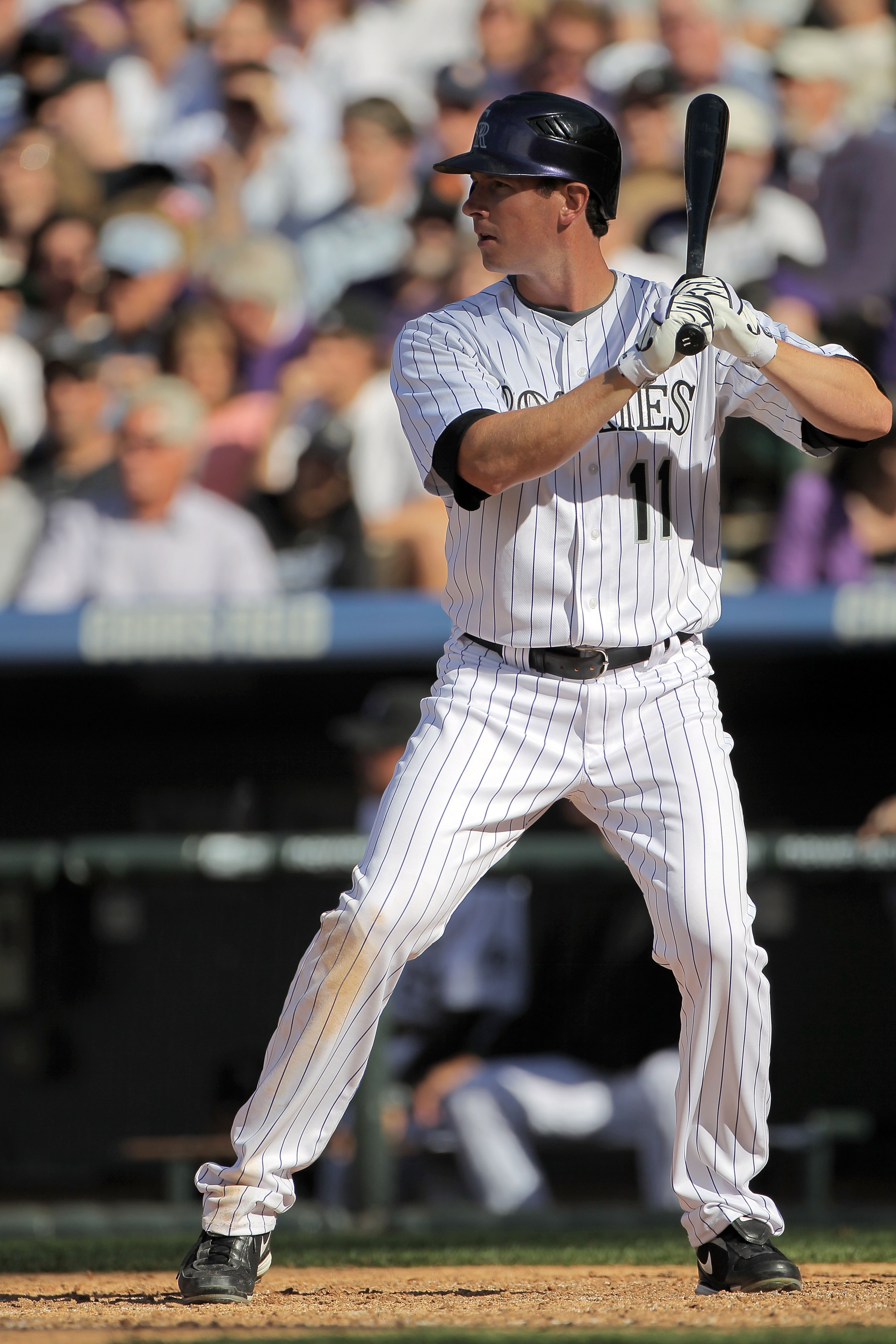 DENVER - APRIL 09:  Brad Hawpe #11 of the Colorado Rockies takes an at bat against the San Diego Padres during MLB action on Opening Day at Coors Field on April 9, 2010 in Denver, Colorado. The Rockies defeated the Padres 7-0.  (Photo by Doug Pensinger/Ge