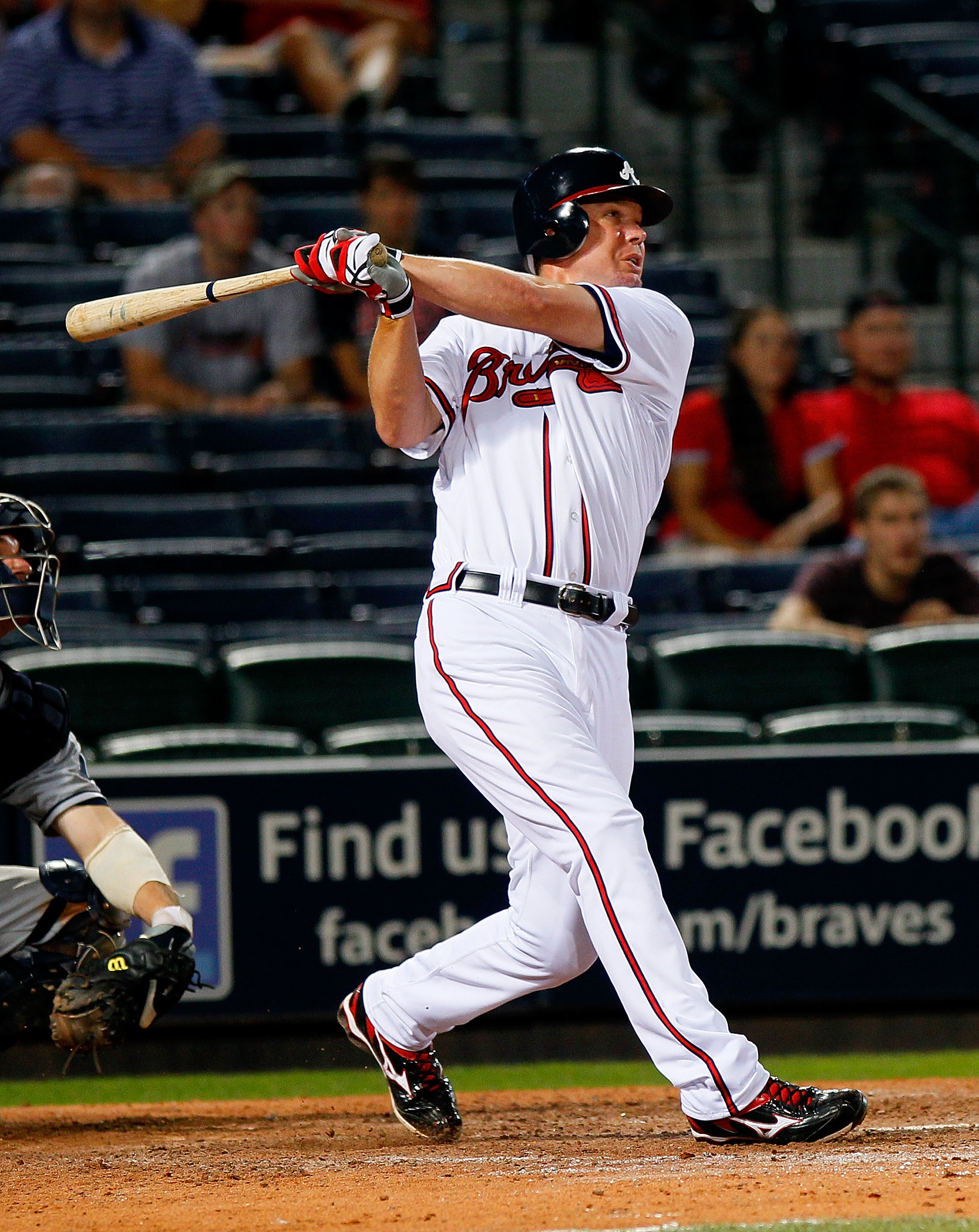 Atlanta Braves' Dan Uggla, right, bangs forearms with Chipper