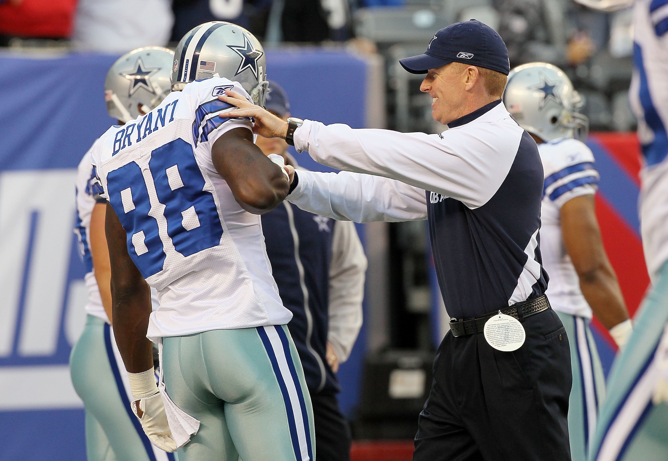 EAST RUTHERFORD, NJ - NOVEMBER 14: Head coach Jason Garrett of the Dallas Cowboys jokes with Dez Bryant #88 as his team warms up prior to playing against the New York Giants on November 14, 2010 at the New Meadowlands Stadium in East Rutherford, New Jers EAST RUTHERFORD, NJ - NOVEMBER 14: Head coach Jason Garrett of the Dallas Cowboys jokes with Dez Bryant #88 as his team warms up prior to playing against the New York Giants on November 14, 2010 at the New Meadowlands Stadium in East Rutherford, New Jers