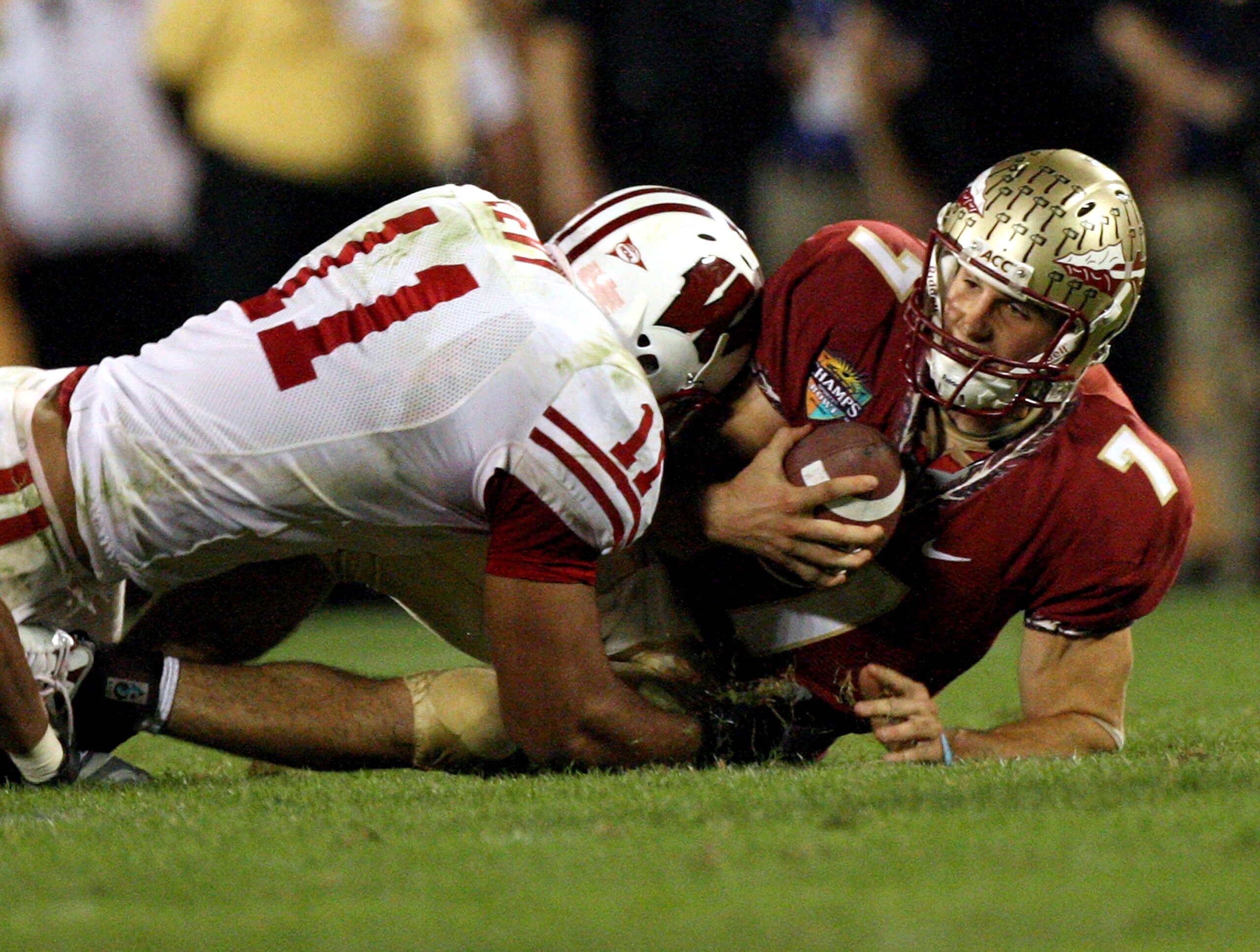 ORLANDO, FL - DECEMBER 27:  Quarterback Christian Ponder #7 of the Florida State Seminoles is sacked by DeAndre Levy #11 of the Wisconsin Badgers during the Champs Bowl on December 27, 2008 at the Citrus Bowl in Orlando, Florida.  (Photo by Sam Greenwood/
