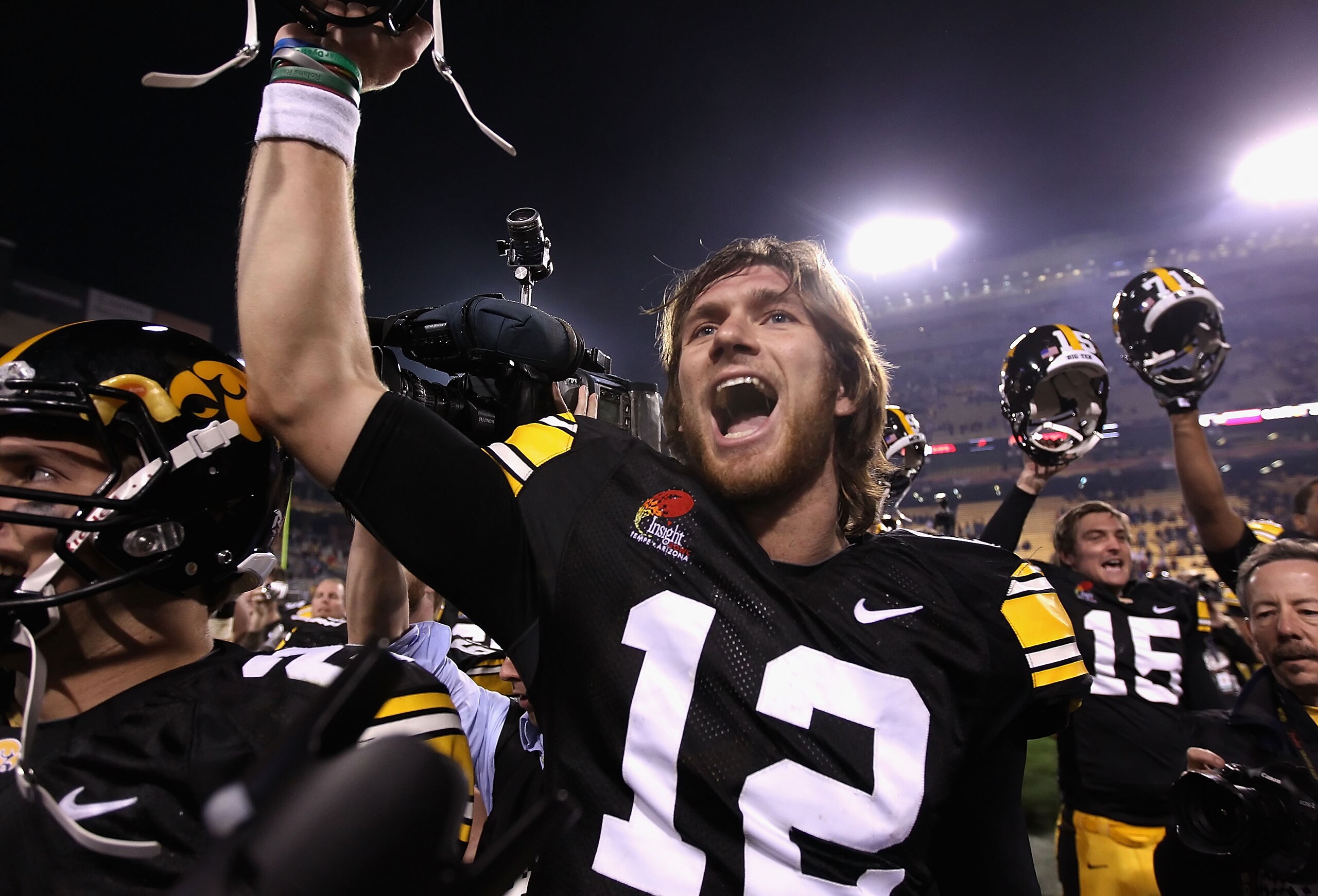 TEMPE, AZ - DECEMBER 28:  Quarterback Ricky Stanzi #12 of the Iowa Hawkeyes celebrates with teammates after defeating the Missouri Tigers in the Insight Bowl at Sun Devil Stadium on December 28, 2010 in Tempe, Arizona. The Hawkeyes defeated the Tigers 27-