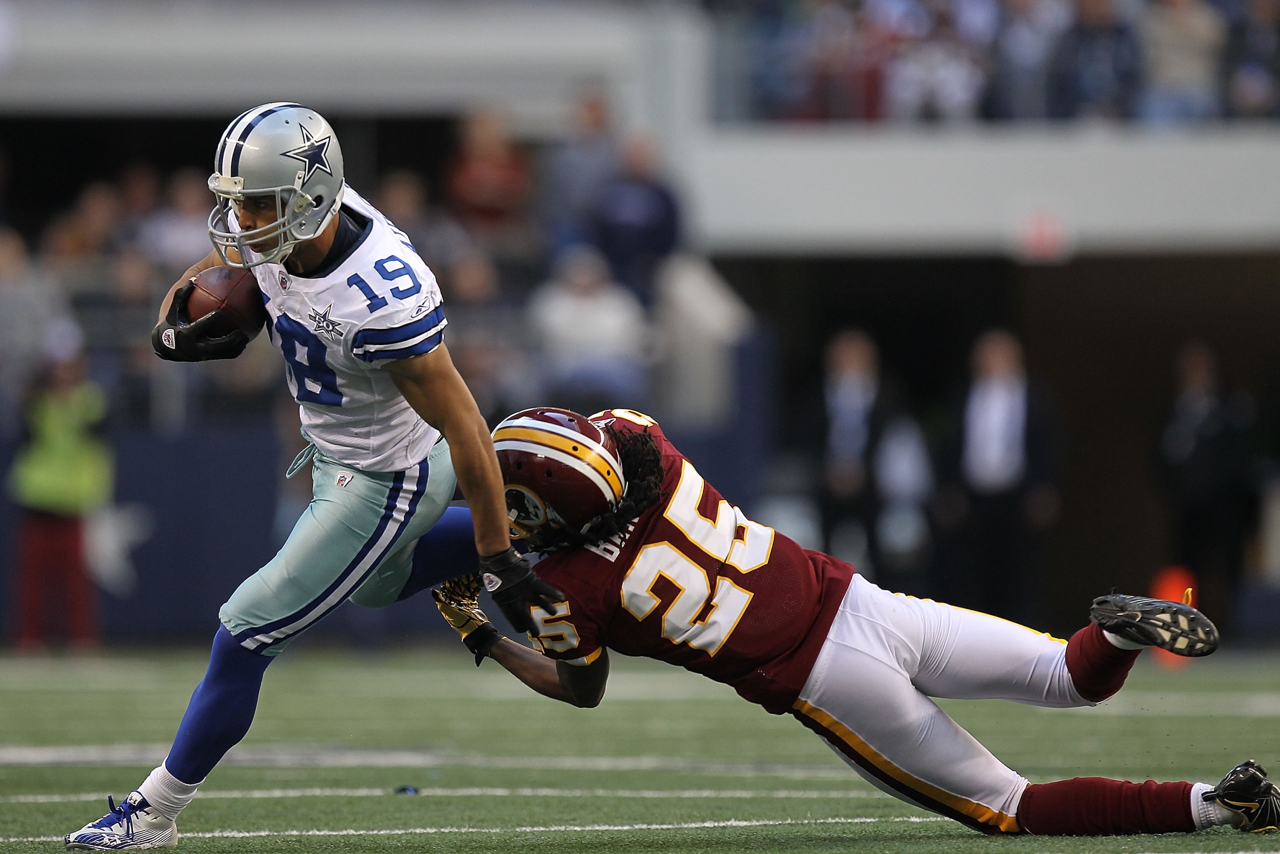 ARLINGTON, TX - DECEMBER 19: Wide receiver Miles Austin #19 of the Dallas Cowboys runs the ball against Kevin Barnes #25 of the Washington Redskins at Cowboys Stadium on December 19, 2010 in Arlington, Texas. (Photo by Ronald Martinez/Getty Images) ARLINGTON, TX - DECEMBER 19: Wide receiver Miles Austin #19 of the Dallas Cowboys runs the ball against Kevin Barnes #25 of the Washington Redskins at Cowboys Stadium on December 19, 2010 in Arlington, Texas. (Photo by Ronald Martinez/Getty Images)