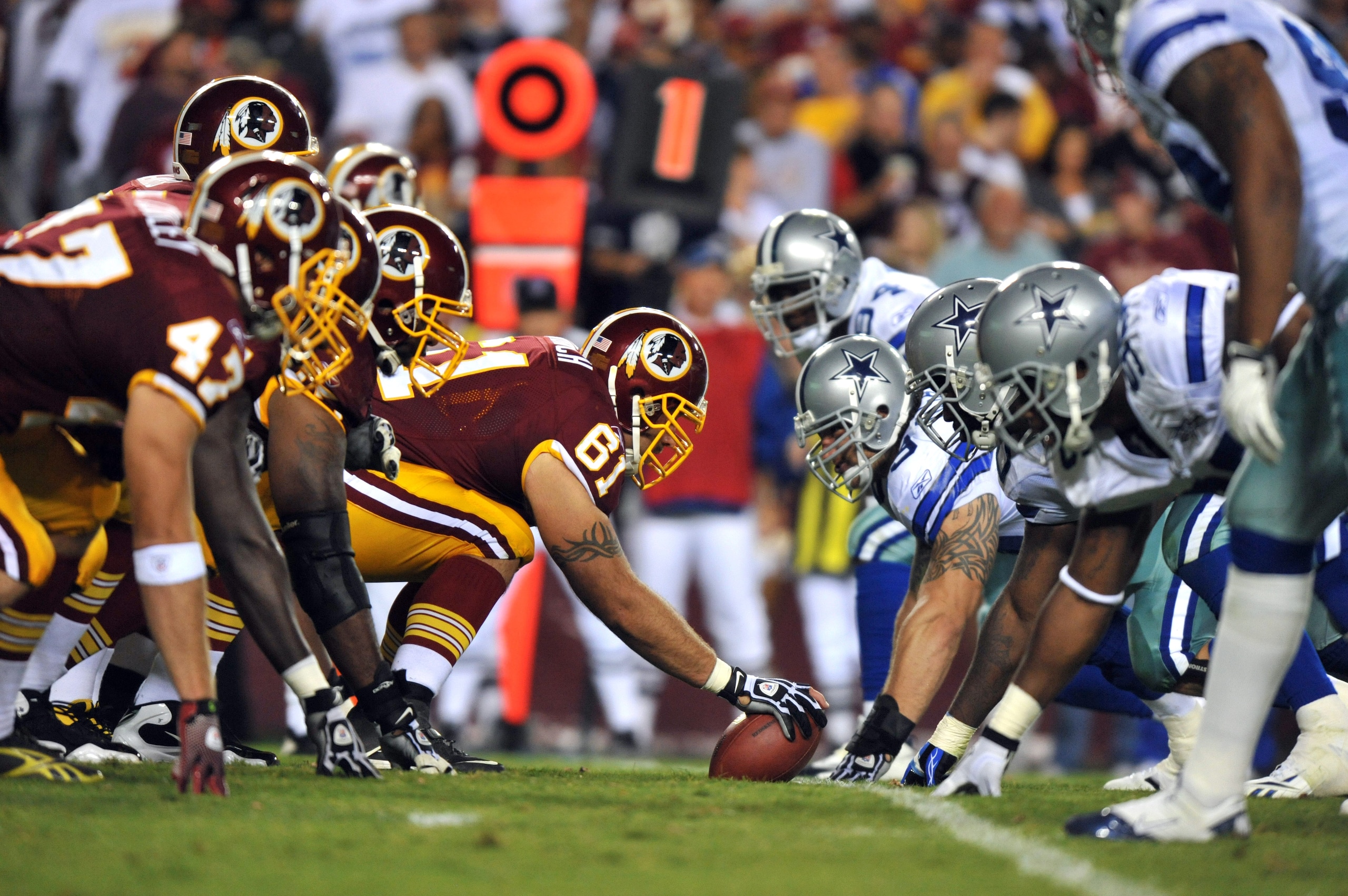 LANDOVER - SEPTEMBER 12: Casey Rabach #61 of the Washington Redskins snaps the ball during the NFL season opener against the Dallas Cowboys at FedExField on September 12, 2010 in Landover, Maryland. The Redskins defeated the Cowboys 13-7. (Photo by Larry LANDOVER - SEPTEMBER 12: Casey Rabach #61 of the Washington Redskins snaps the ball during the NFL season opener against the Dallas Cowboys at FedExField on September 12, 2010 in Landover, Maryland. The Redskins defeated the Cowboys 13-7. (Photo by Larry