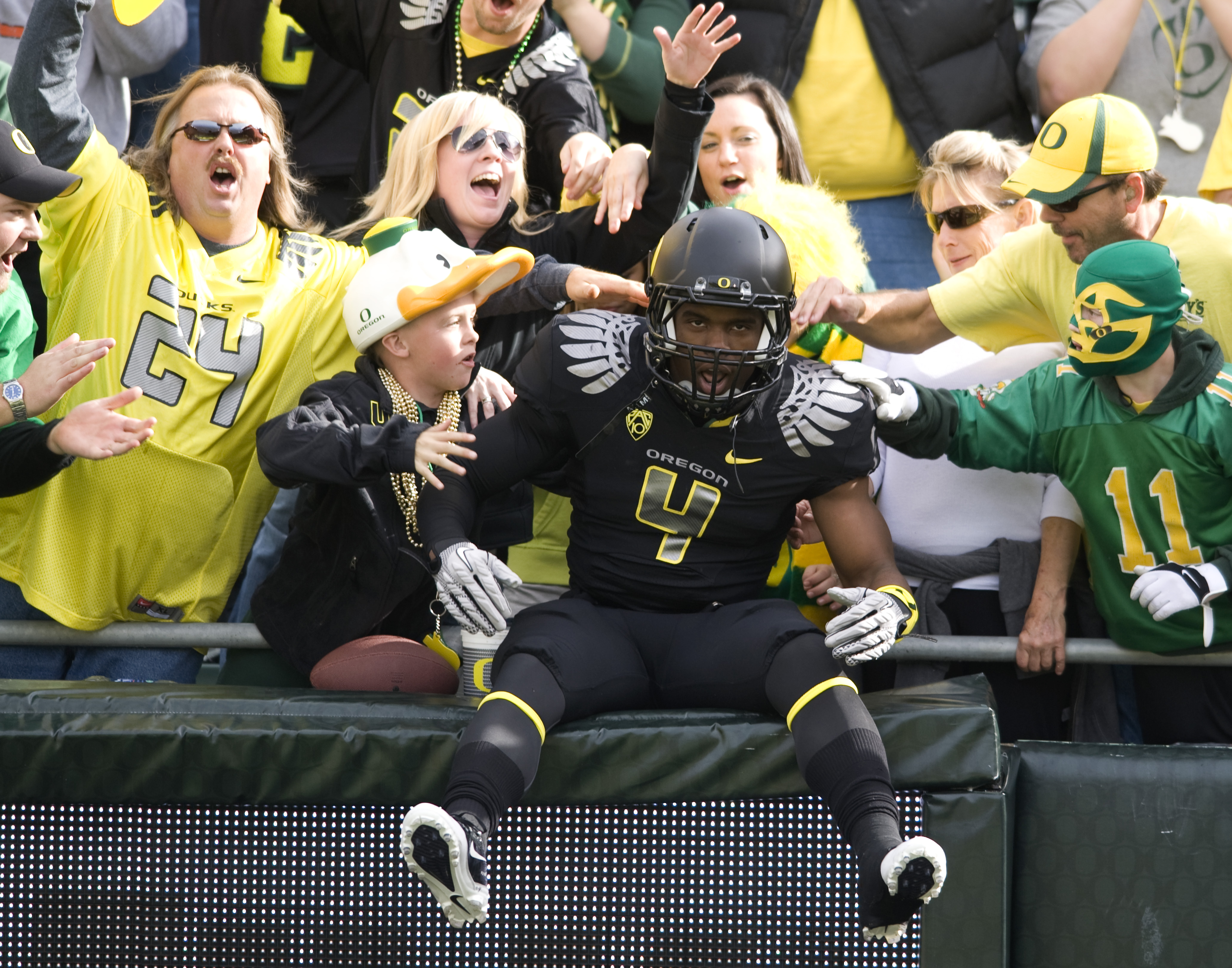 EUGENE, OR - NOVEMBER 6: Wide receiver Josh Huff #4 of the Oregon Ducks jumps into the crowd during the team introductions before the game against the Washington Huskies at Autzen Stadium on November 6, 2010 in Eugene, Oregon. The Ducks won the game 53-16