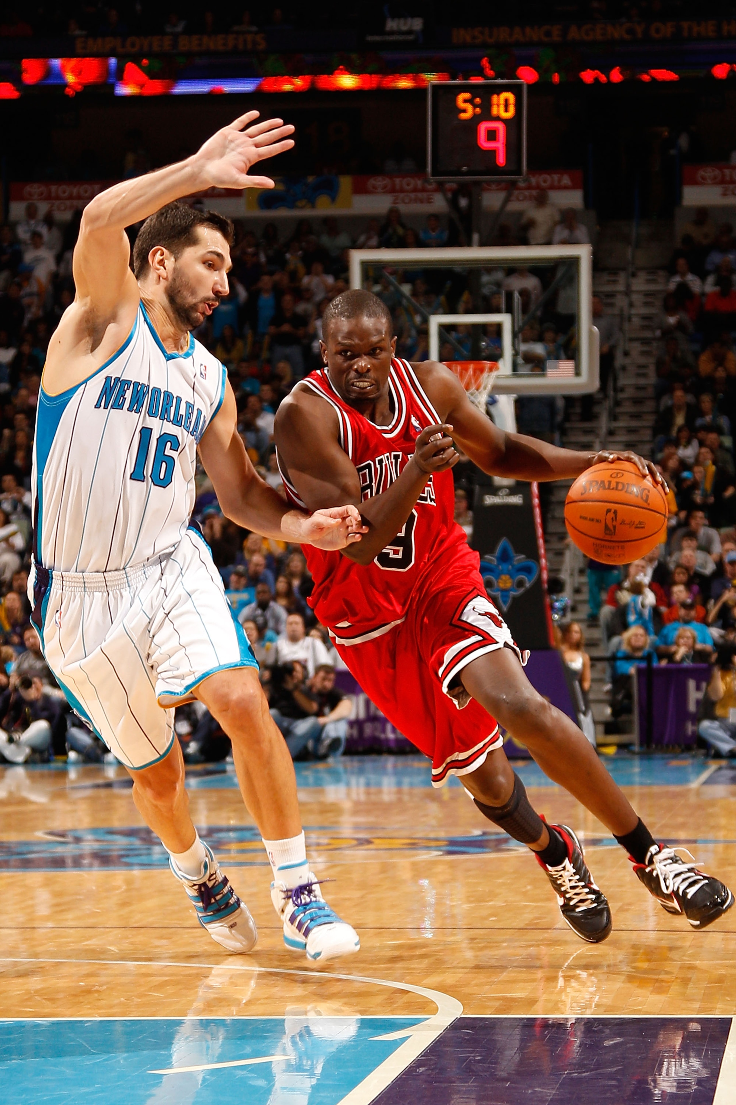 NEW ORLEANS - JANUARY 29:  Luol Deng #9 of the Chicago Bulls drives the ball around Peja Stojakovic #16 of the New Orleans Hornets at the New Orleans Arena on January 29, 2010 in New Orleans, Louisiana.   The Bulls defeated the Hornets 108-106 in overtime