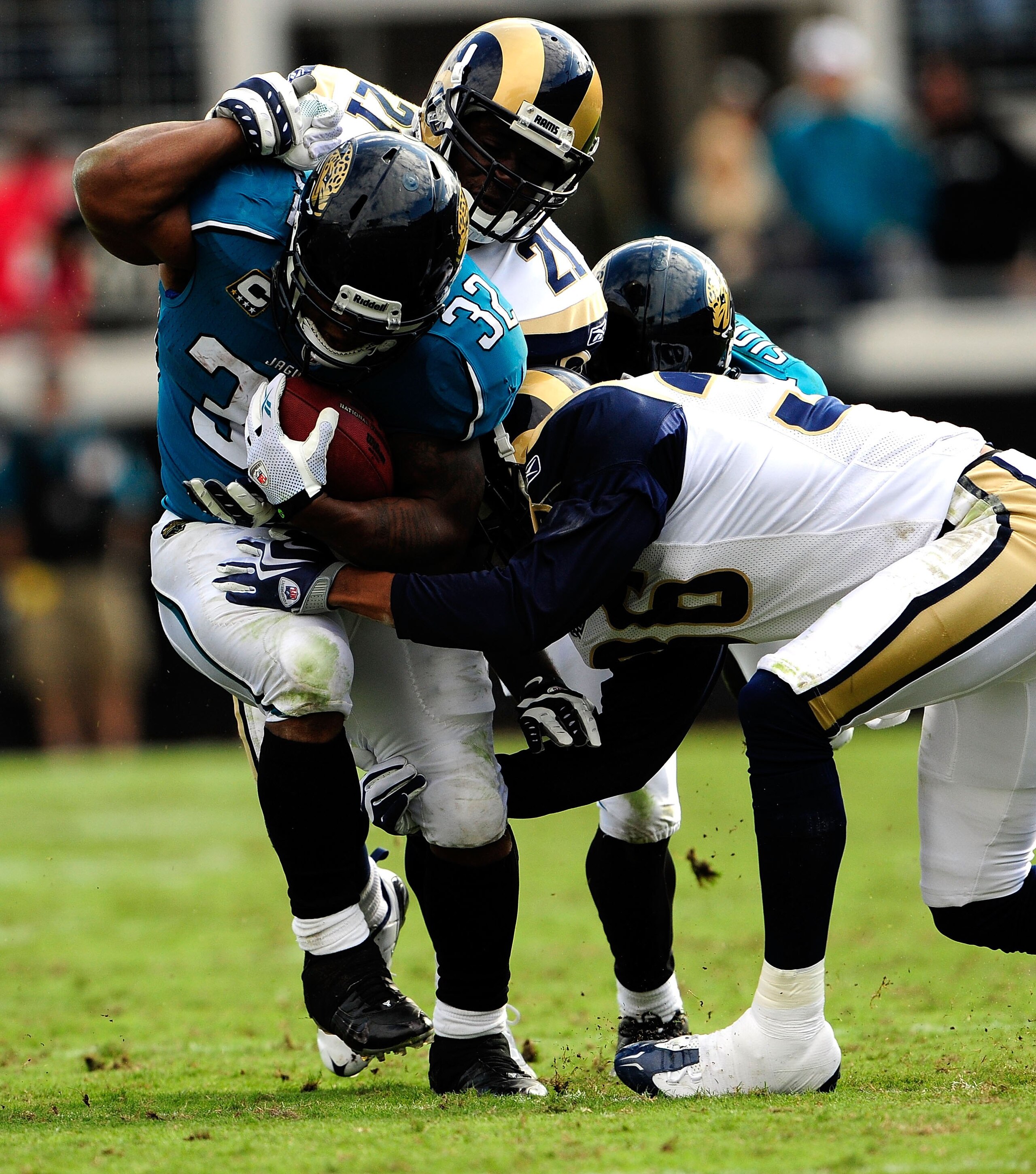 JACKSONVILLE, FL - OCTOBER 18:  Maurice Jones-Drew #32 of the Jacksonville Jaguars is tackled by Oshiomogho Atogwe #21 of the St. Louis Rams during the game at Jacksonville Municipal Stadium on October 18, 2009 in Jacksonville, Florida.  (Photo by Sam Gre