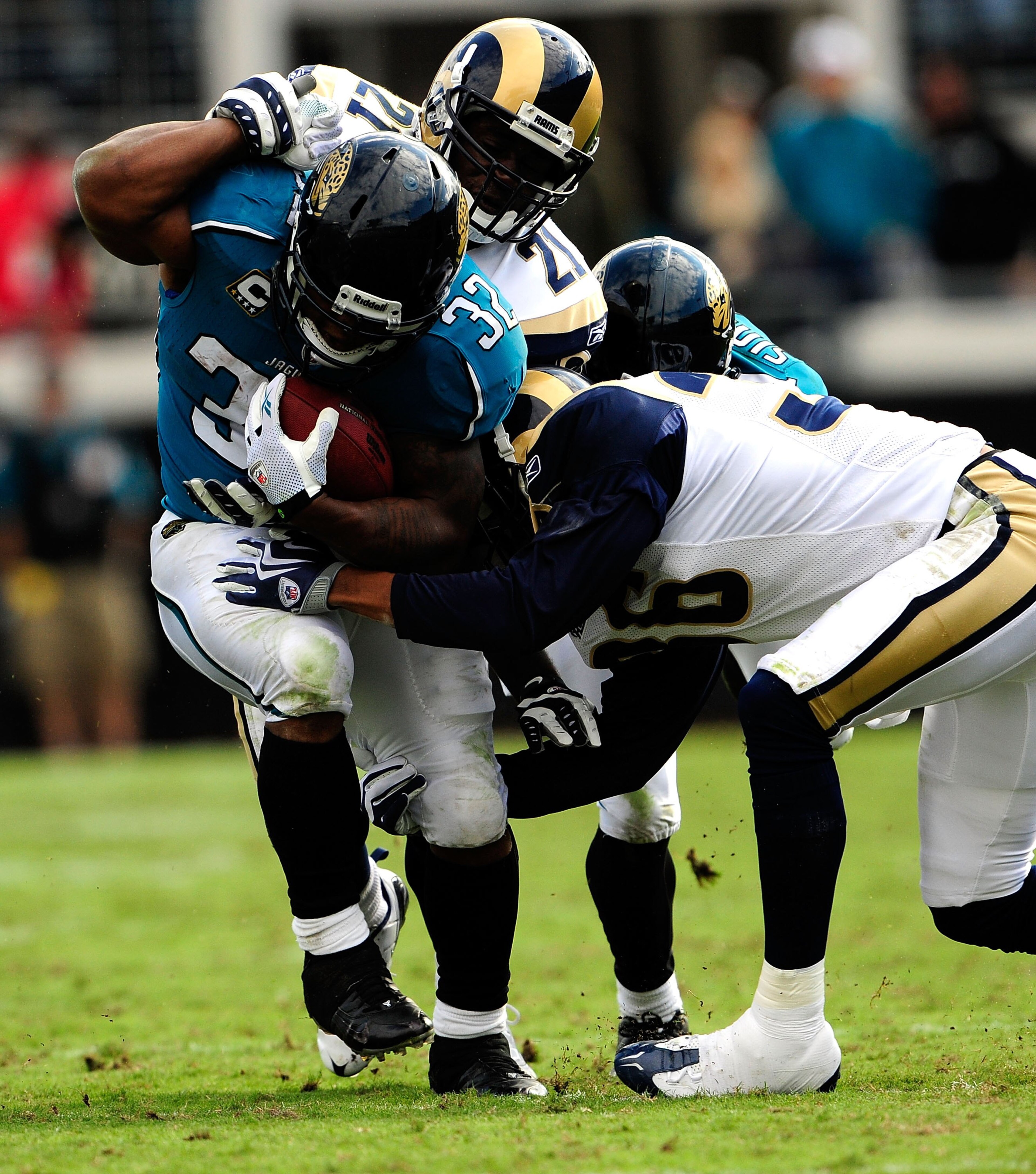 JACKSONVILLE, FL - OCTOBER 18:  Maurice Jones-Drew #32 of the Jacksonville Jaguars is tackled by Oshiomogho Atogwe #21 of the St. Louis Rams during the game at Jacksonville Municipal Stadium on October 18, 2009 in Jacksonville, Florida.  (Photo by Sam Gre