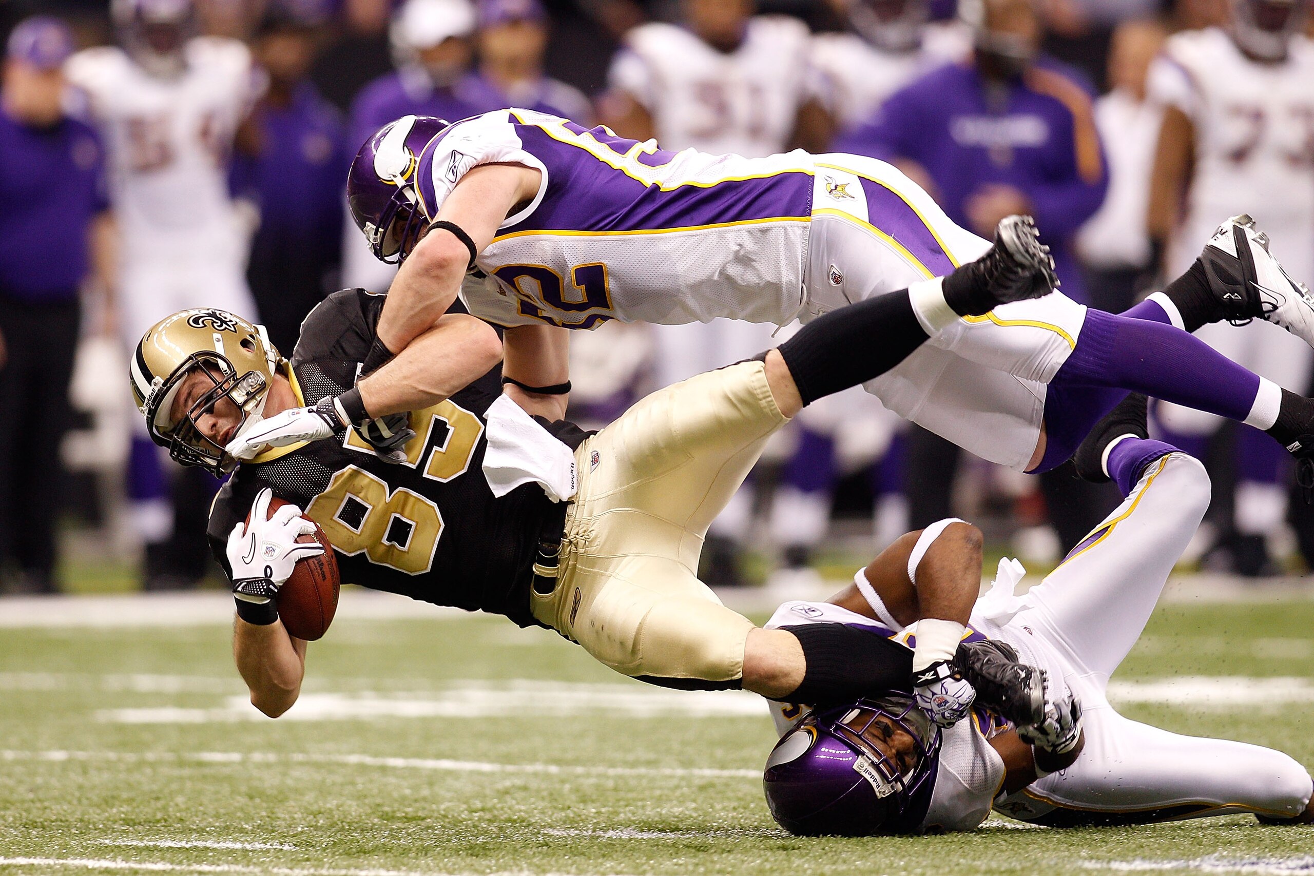 NEW ORLEANS - JANUARY 24:  Jeremy Shockey #88 of the New Orleans Saints gets tackled by Chad Greenway #52 and Antoine Winfield #26 of the Minnesota Vikings after catching a pass for a first down during the NFC Championship Game at the Louisana Superdome o