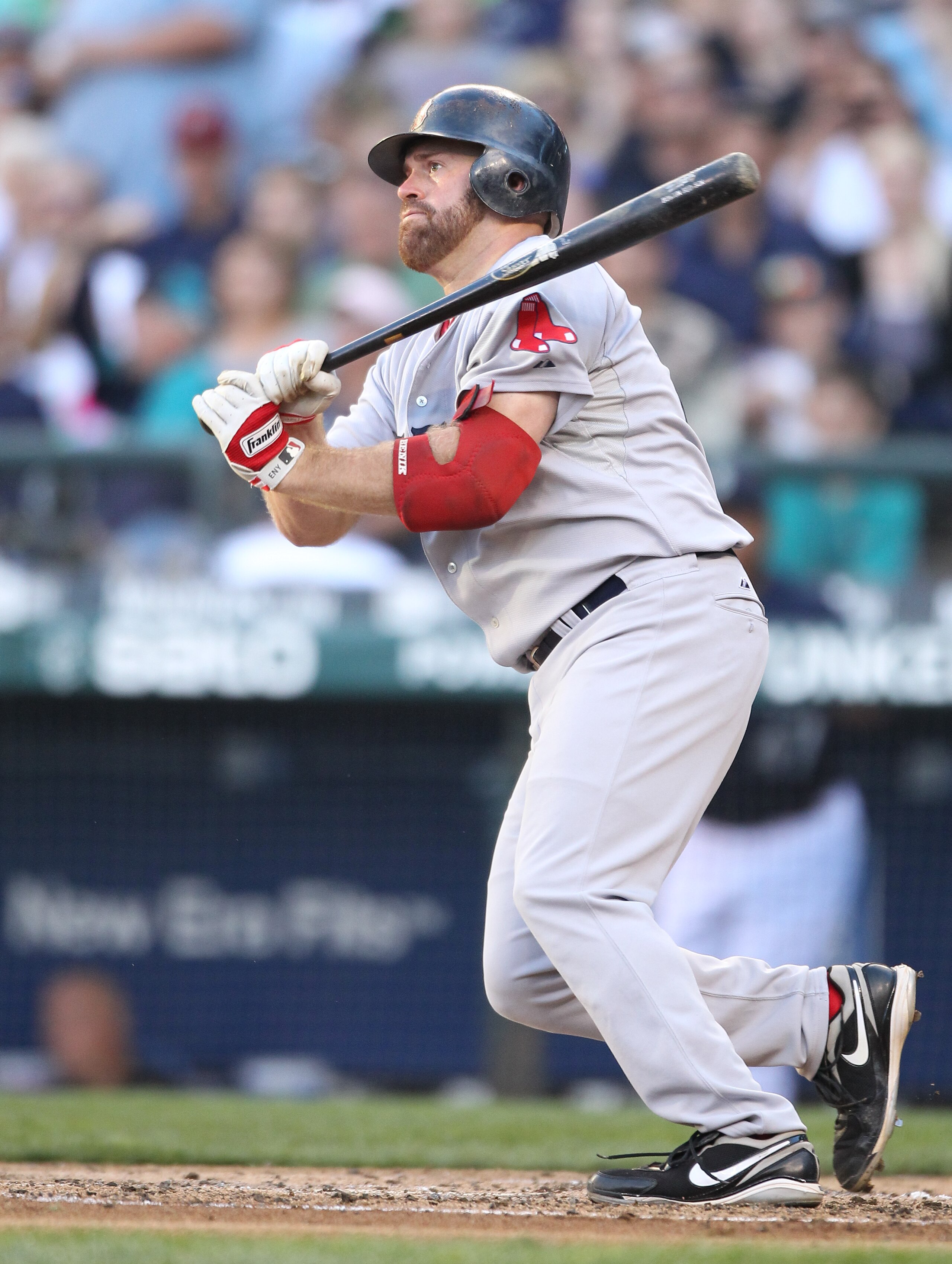 SEATTLE - JULY 23: Kevin Youkilis #20 of the Boston Red Sox singles in the fourth inning against the Seattle Mariners at Safeco Field on July 23, 2010 in Seattle, Washington. (Photo by Otto Greule Jr/Getty Images)