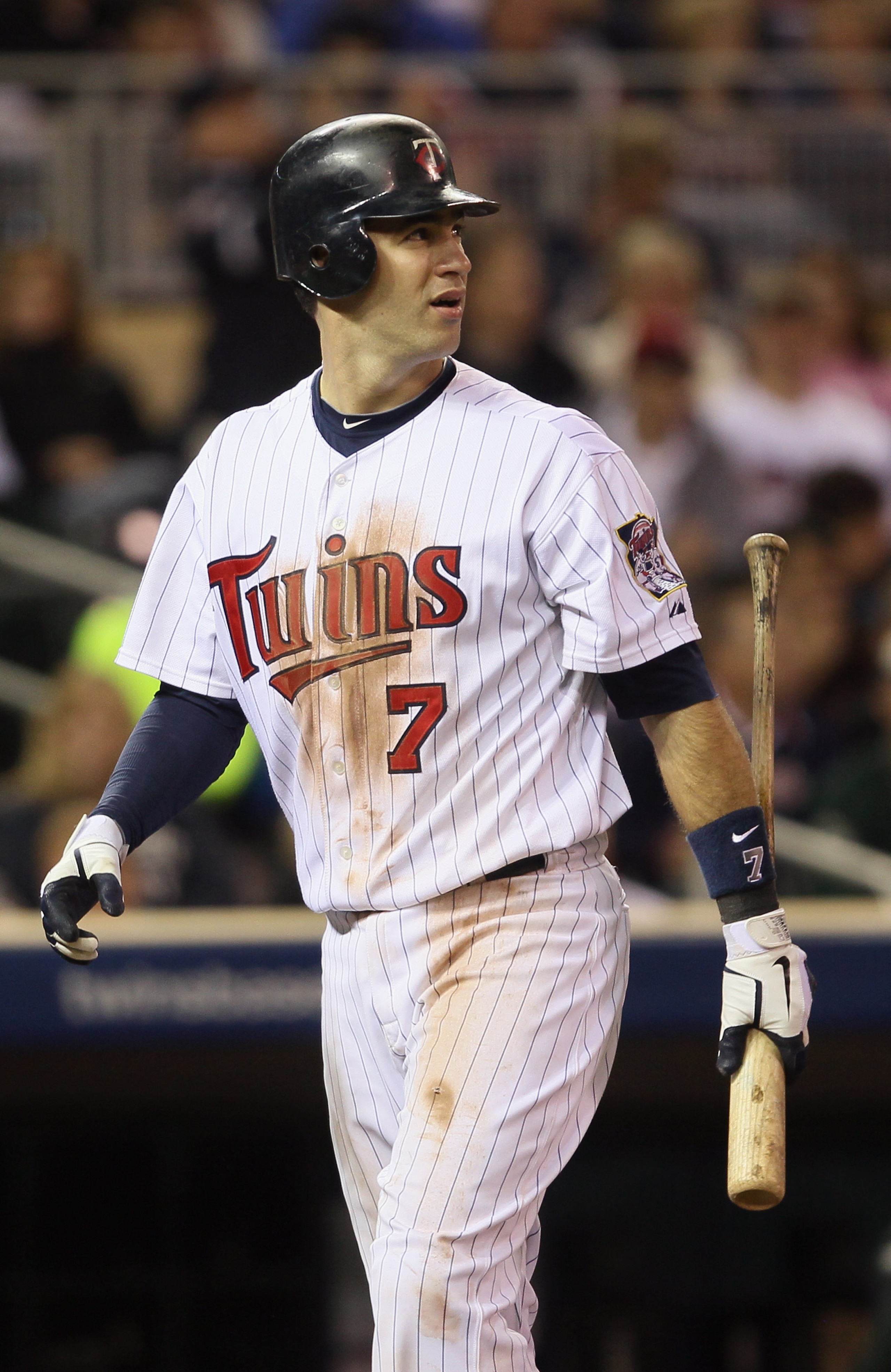 MINNEAPOLIS - OCTOBER 06:  Joe Mauer #7 of the Minnesota Twins reacts after he strikes out against the New York Yankees during game one of the ALDS on October 6, 2010 at Target Field in Minneapolis, Minnesota.  (Photo by Elsa/Getty Images)