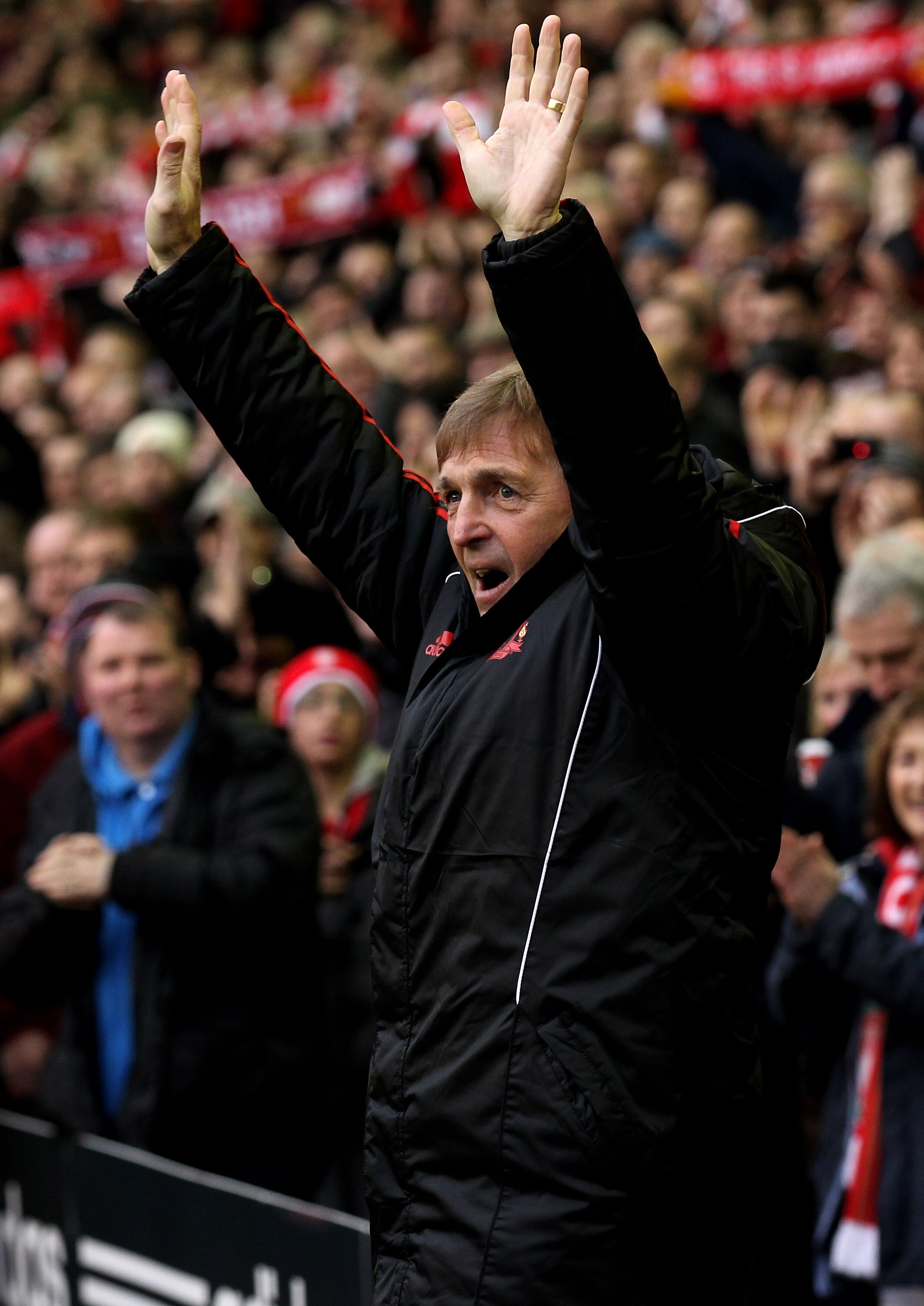 LIVERPOOL, ENGLAND - JANUARY 16:  Liverpool Manager Kenny Dalglish salutes the fans prior to the Barclays Premier League match between Liverpool and Everton at Anfield on January 16, 2011 in Liverpool, England. (Photo by Alex Livesey /Getty Images)