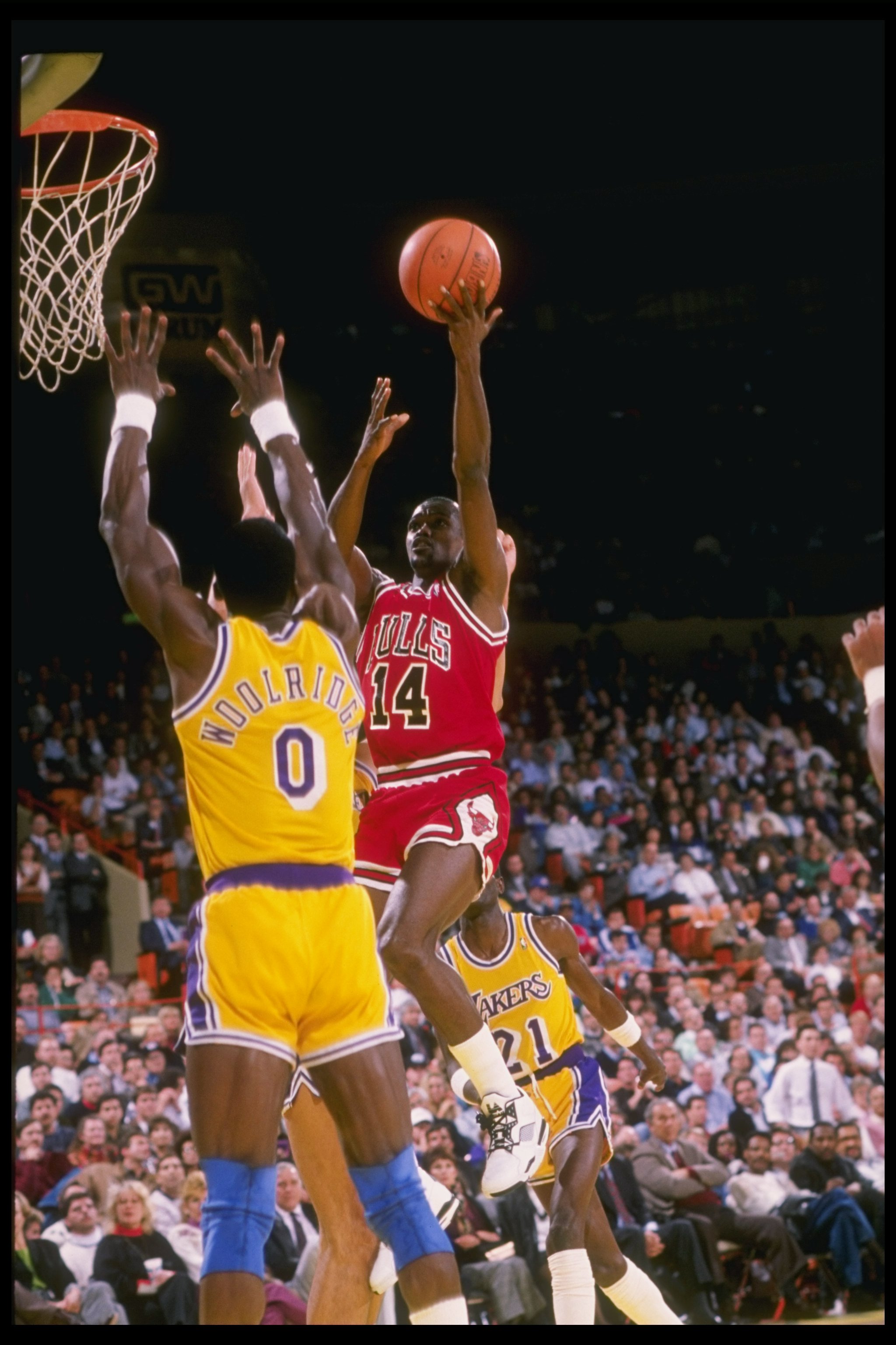 1989-1990:  Guard Craig Hodges of the Chicago Bulls goes up against forward Orlando Woolridge of the Los Angeles Lakers (left) during a game at the Great Western Forum in Inglewood, California. Mandatory Credit: Stephen Dunn  /Allsport