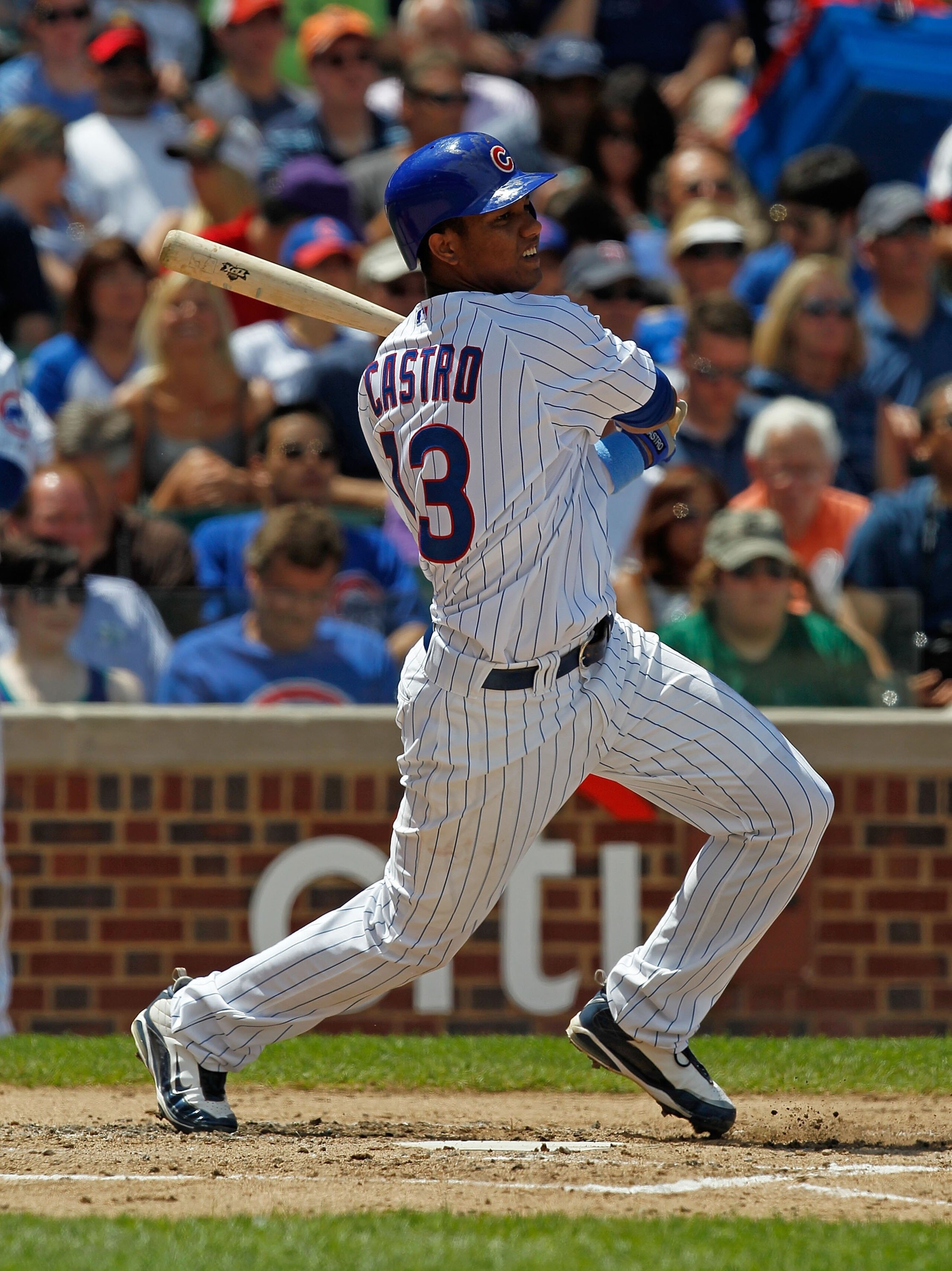 CHICAGO - JUNE 20: Starlin Castro #13 of the Chicago Cubs hits the ball against the Los Angeles Angels of Anaheim at Wrigley Field on June 20, 2010 in Chicago, Illinois. The Cubs defeated the Angels 12-1. (Photo by Jonathan Daniel/Getty Images)