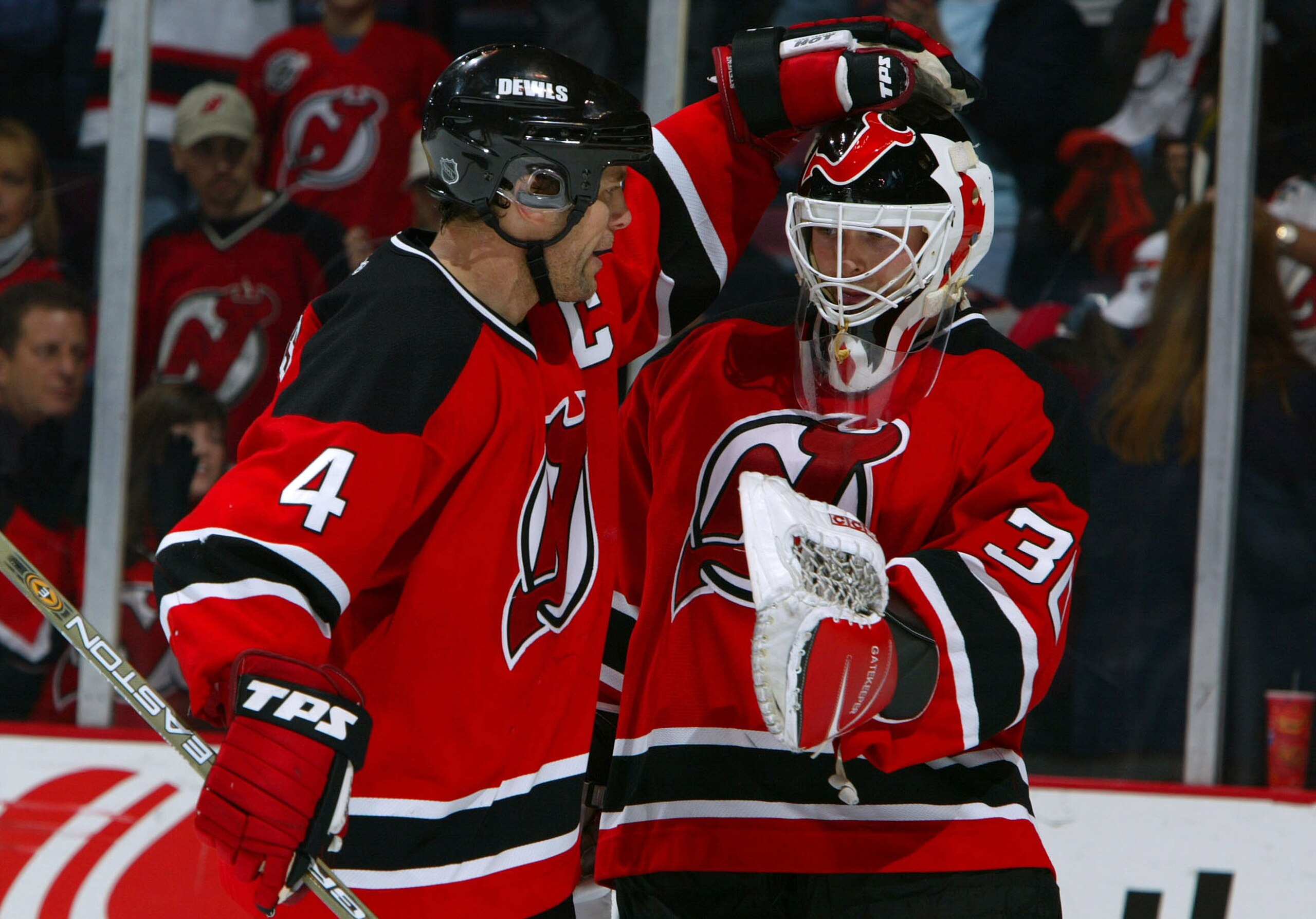 EAST RUTHERFORD, NJ - NOVEMBER19: Scott Stevens #4 of the New Jersey Devils celebrates a 4-1 victory with Martin Brodeur over the Buffalo Sabres at the Continental Airlines Arena on November 19, 2003 in East Rutherford, New Jersey. (Photo by Al Bello/Ge EAST RUTHERFORD, NJ - NOVEMBER19: Scott Stevens #4 of the New Jersey Devils celebrates a 4-1 victory with Martin Brodeur over the Buffalo Sabres at the Continental Airlines Arena on November 19, 2003 in East Rutherford, New Jersey. (Photo by Al Bello/Ge