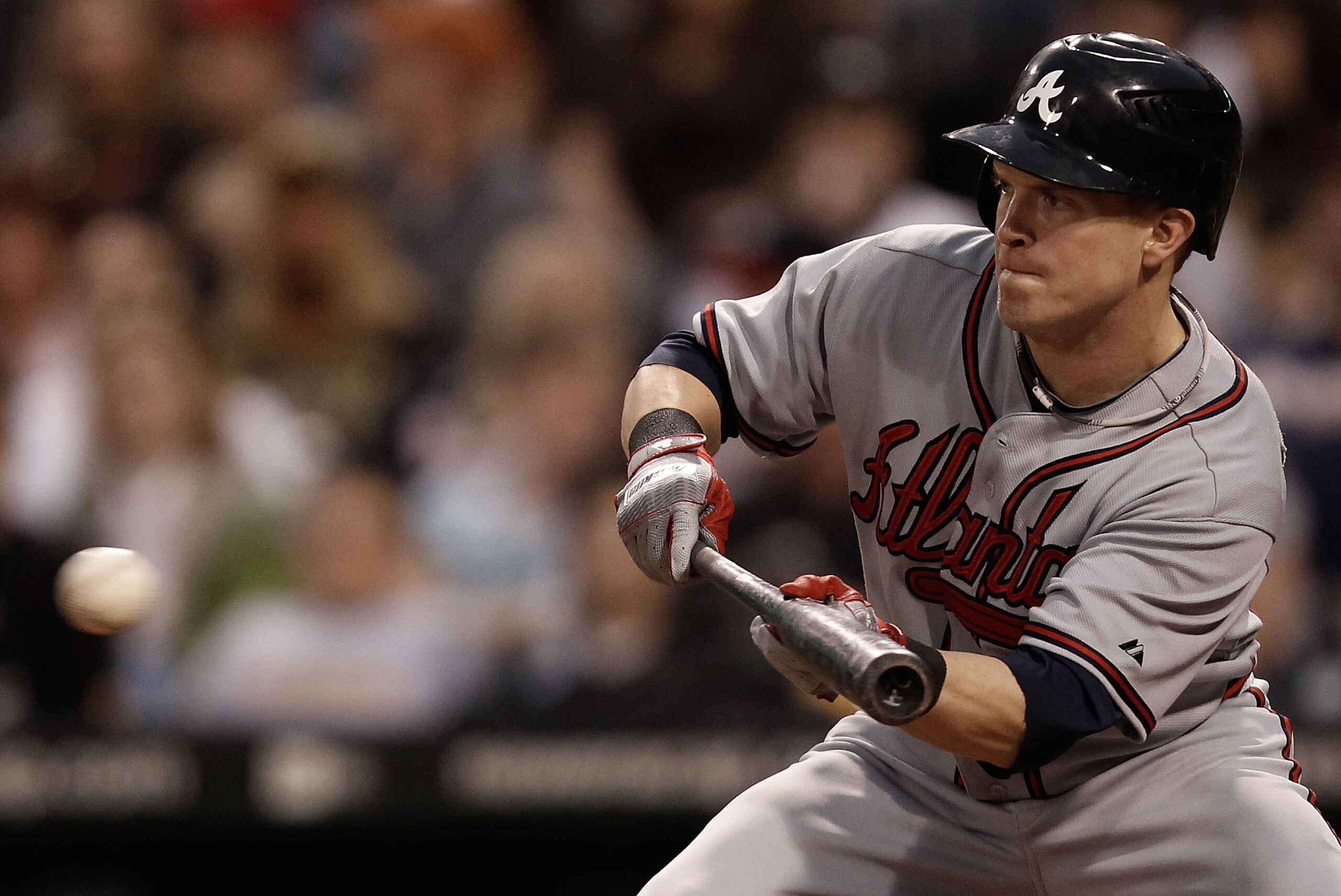 PITTSBURGH - MAY 21:  Nate McLouth #24 of the Atlanta Braves lays down a bunt against the Pittsburgh Pirates during the game on May 21, 2010 at PNC Park in Pittsburgh, Pennsylvania.  (Photo by Jared Wickerham/Getty Images)
