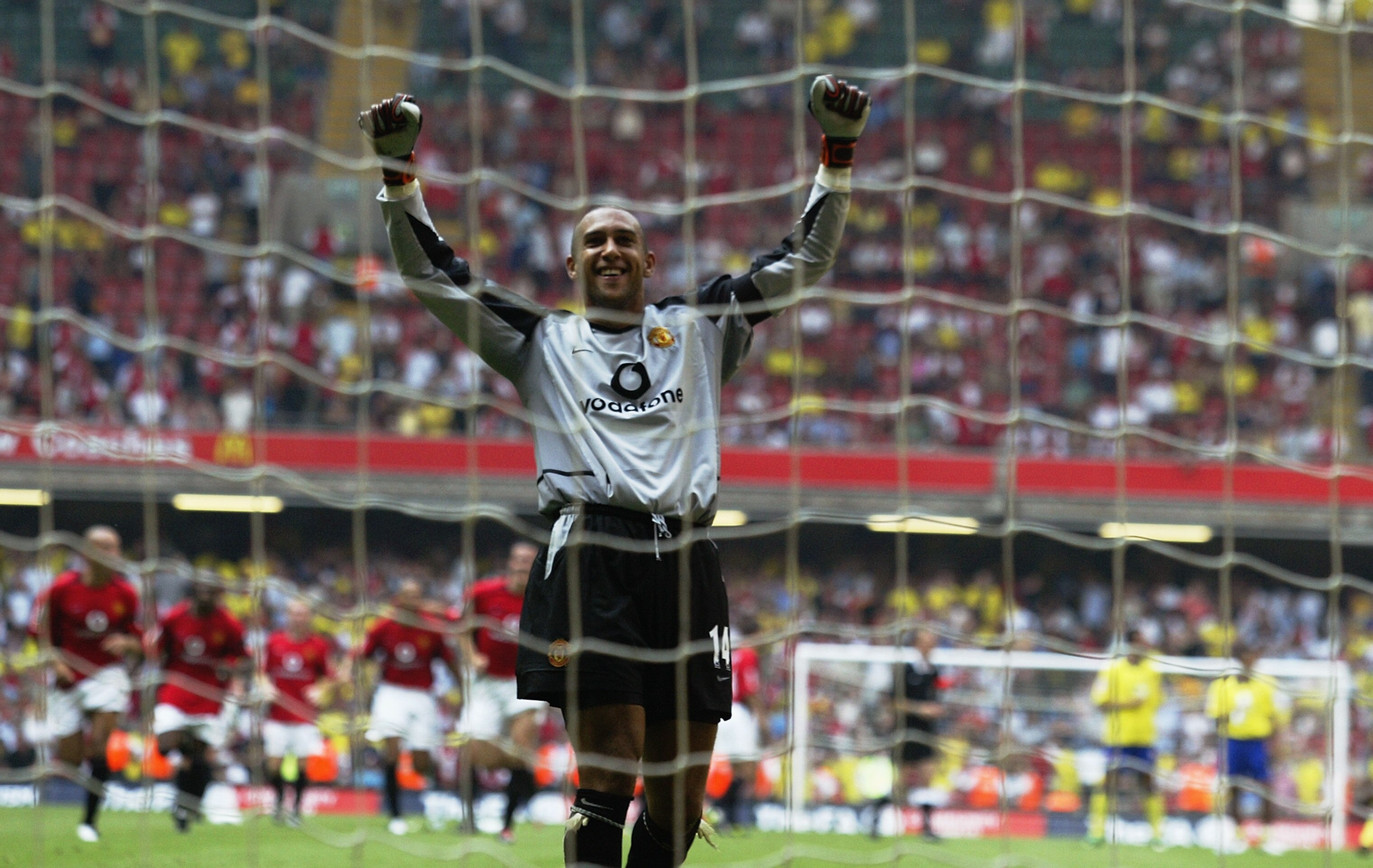 CARDIFF - AUGUST 10:  Tim Howard of Manchester United celebrates winning the Community Shield after he saves the final penalty from Robert Pires of Arsenal during the FA Community Shield match between Arsenal and Manchester United held on August 10, 2003