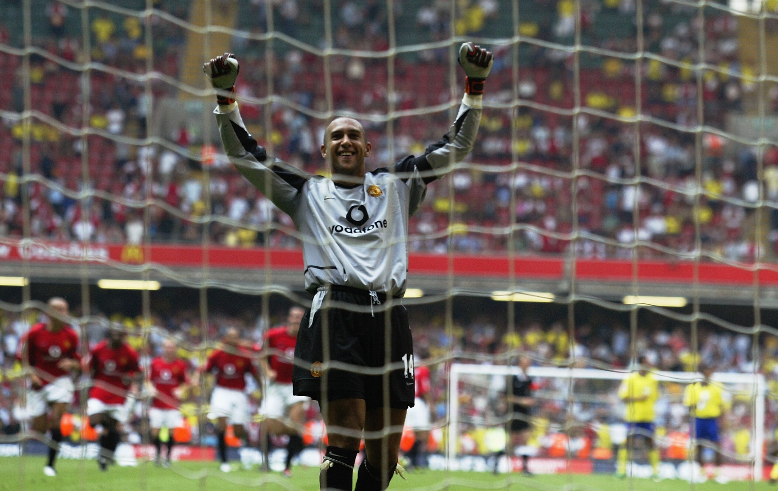 CARDIFF - AUGUST 10:  Tim Howard of Manchester United celebrates winning the Community Shield after he saves the final penalty from Robert Pires of Arsenal during the FA Community Shield match between Arsenal and Manchester United held on August 10, 2003