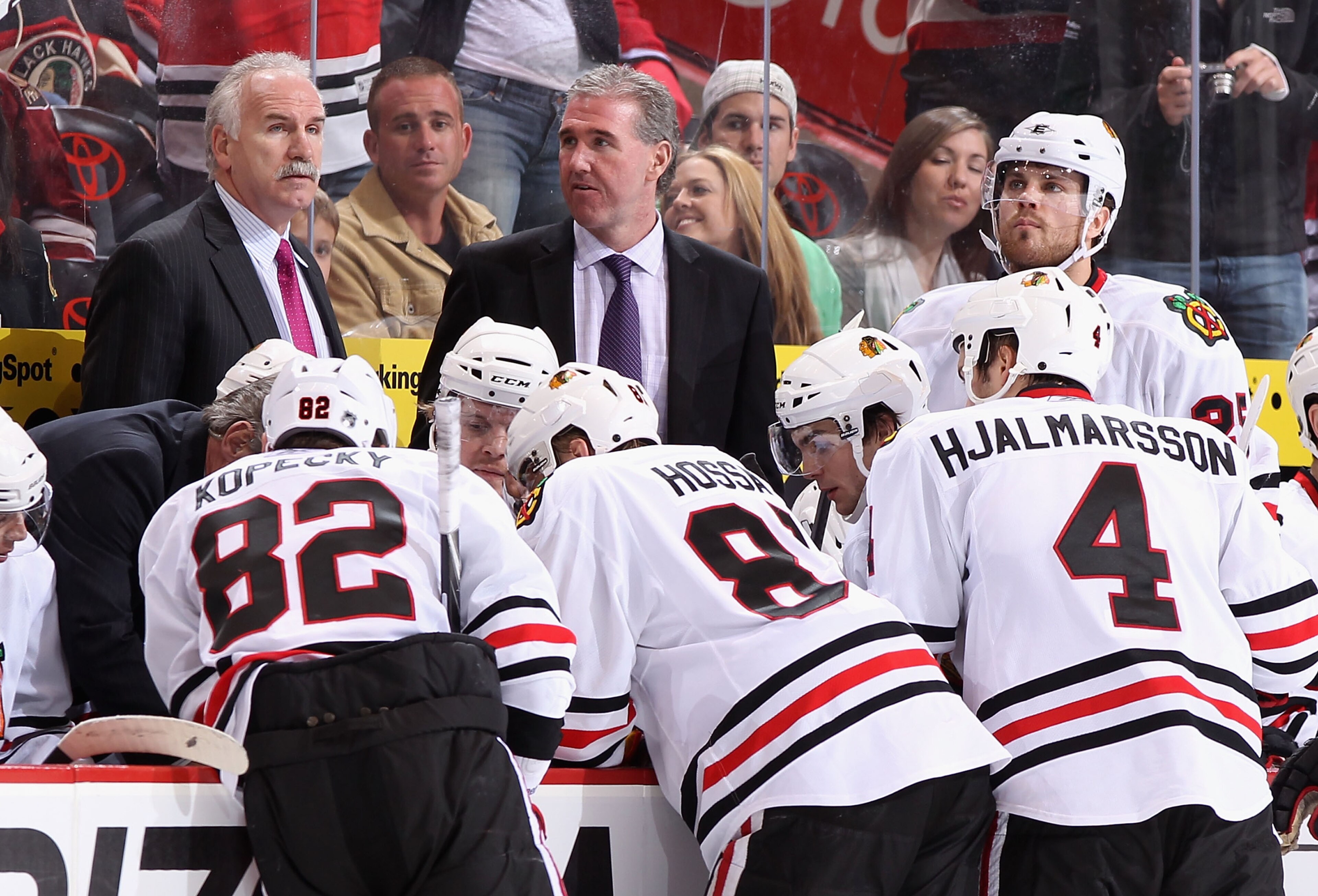 GLENDALE, AZ - FEBRUARY 12: Head coach Joel Quenneville of the Chicago Blackhawks talks with his team during a time out from the NHL game against the Phoenix Coyotes at Jobing.com Arena on February 12, 2011 in Glendale, Arizona. The Coyotes defeated the GLENDALE, AZ - FEBRUARY 12: Head coach Joel Quenneville of the Chicago Blackhawks talks with his team during a time out from the NHL game against the Phoenix Coyotes at Jobing.com Arena on February 12, 2011 in Glendale, Arizona. The Coyotes defeated the