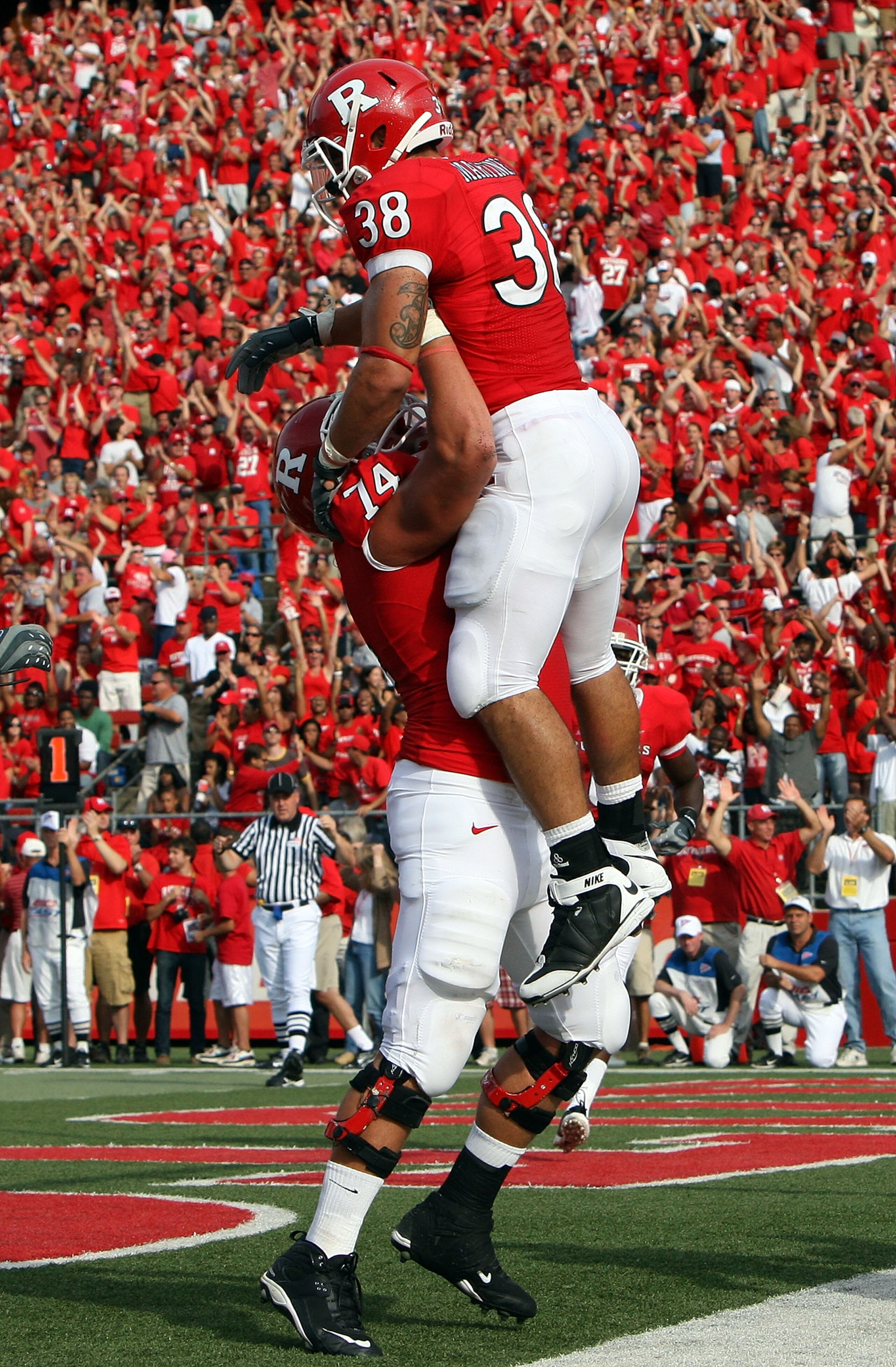 PISCATAWAY, NJ - SEPTEMBER 07:  Joe Martinek #38 of the Rutgers Scarlet Knights celebrates his touchdown against the Cincinnati Bearcats with teammate Howard Barbieri #74 at Rutgers Stadium on September 7, 2009 in Piscataway, New Jersey.  (Photo by Jim Mc