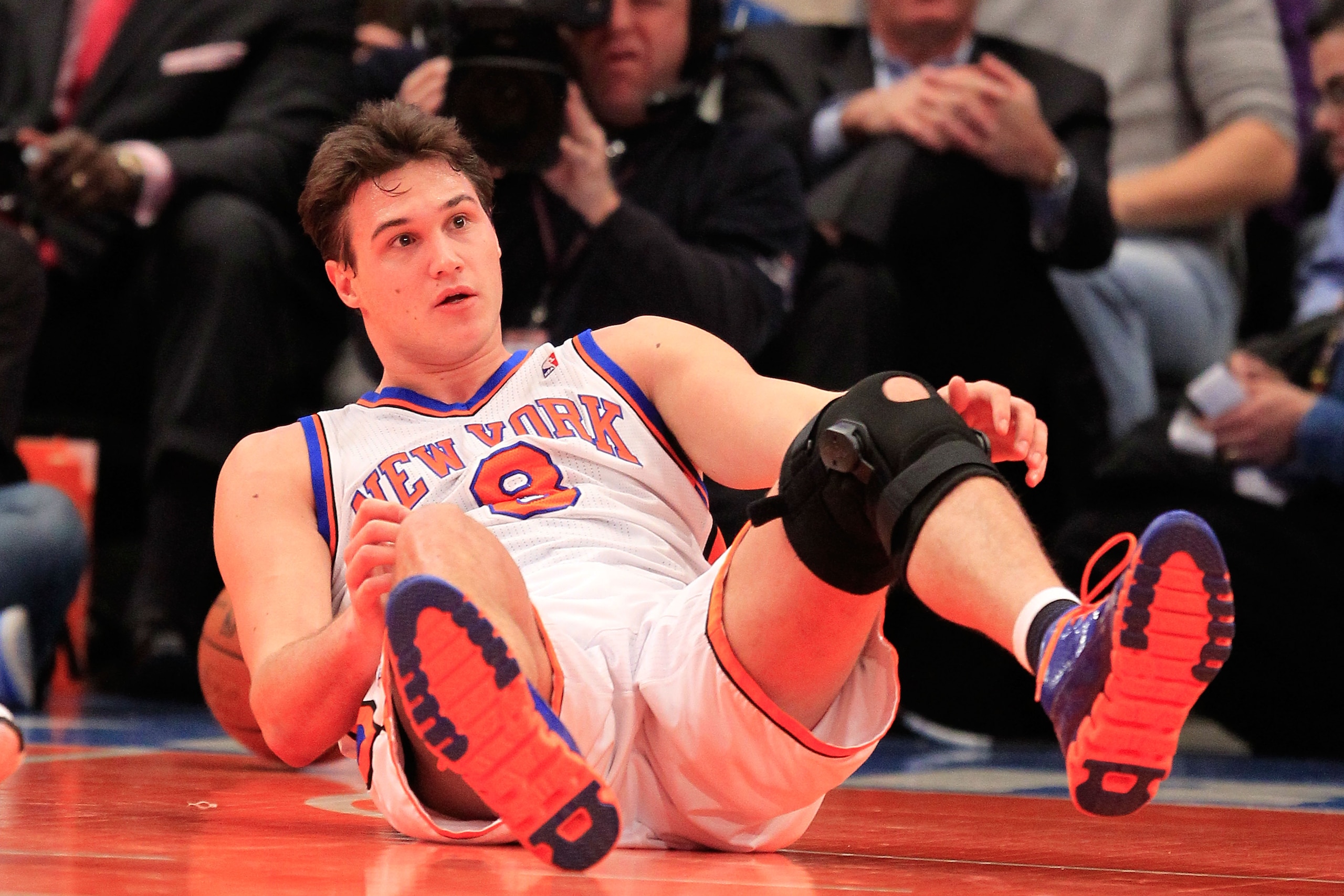 NEW YORK, NY - FEBRUARY 09:  Danilo Gallinari #8 of the New York Knicks falls to the floor against the Los Angeles Clippers at Madison Square Garden on February 9, 2011 in New York City. NOTE TO USER: User expressly acknowledges and agrees that, by downlo