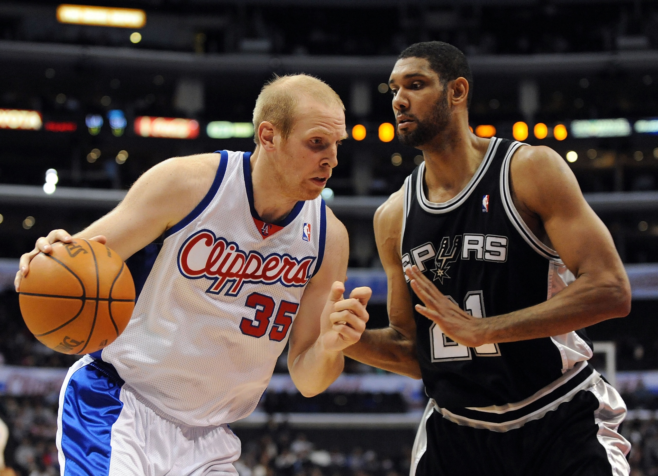 LOS ANGELES, CA - DECEMBER 13:  Chris Kaman #35 of the Los Angeles Clippers dribbles to the basket in front of Tim Duncan #21 of the San Antonio Spurs at Staples Center on December 13, 2009 in Los Angeles, California.  NOTE TO USER: User expressly acknowl