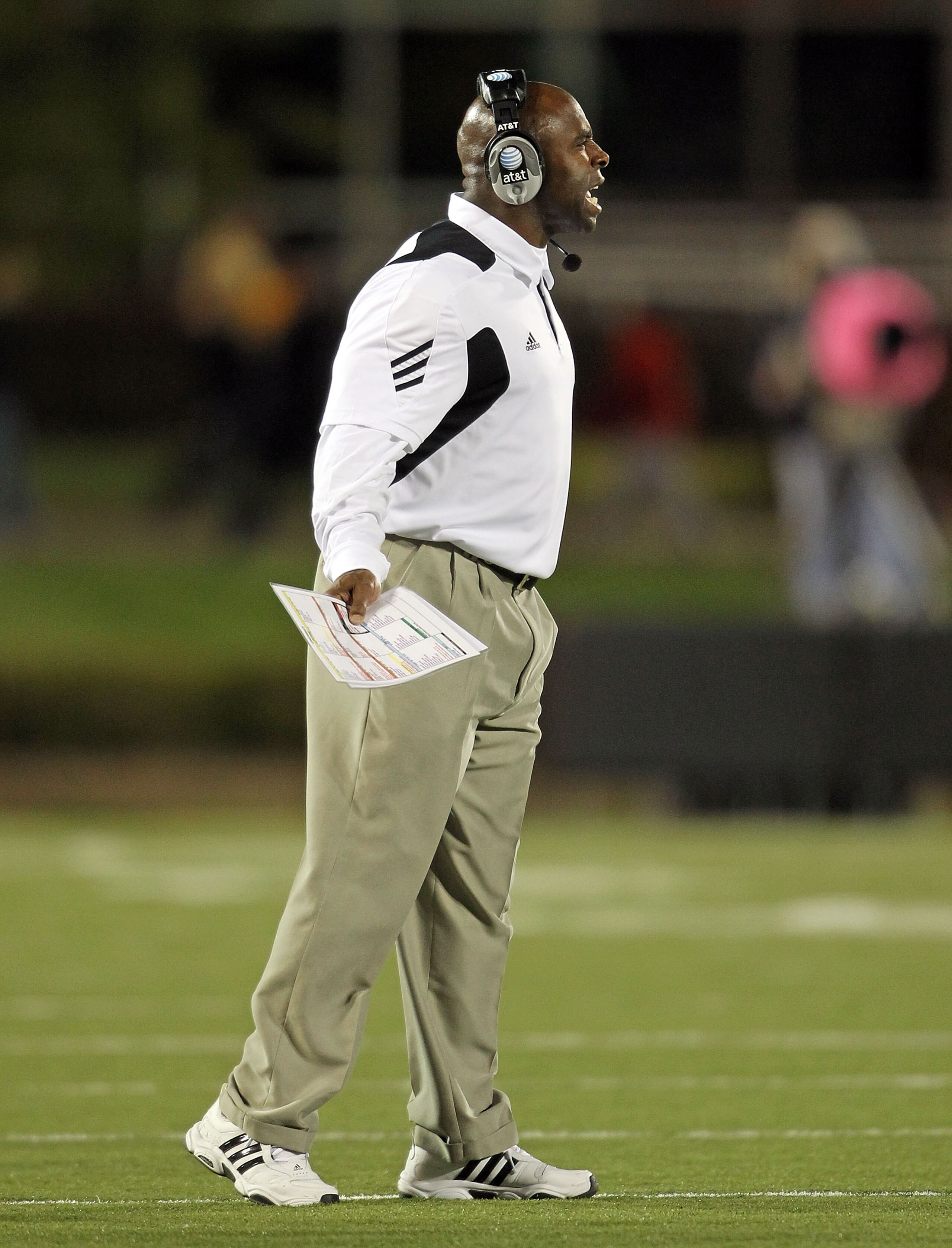LOUISVILLE, KY - OCTOBER 15: Charlie Strong the Haed Coach of the Louisville Cardinals gives instructions to his team during the Big East Conference game against the Cincinnati Bearcats at Papa John's Cardinal Stadium on October 15, 2010 in Louisville, Ke