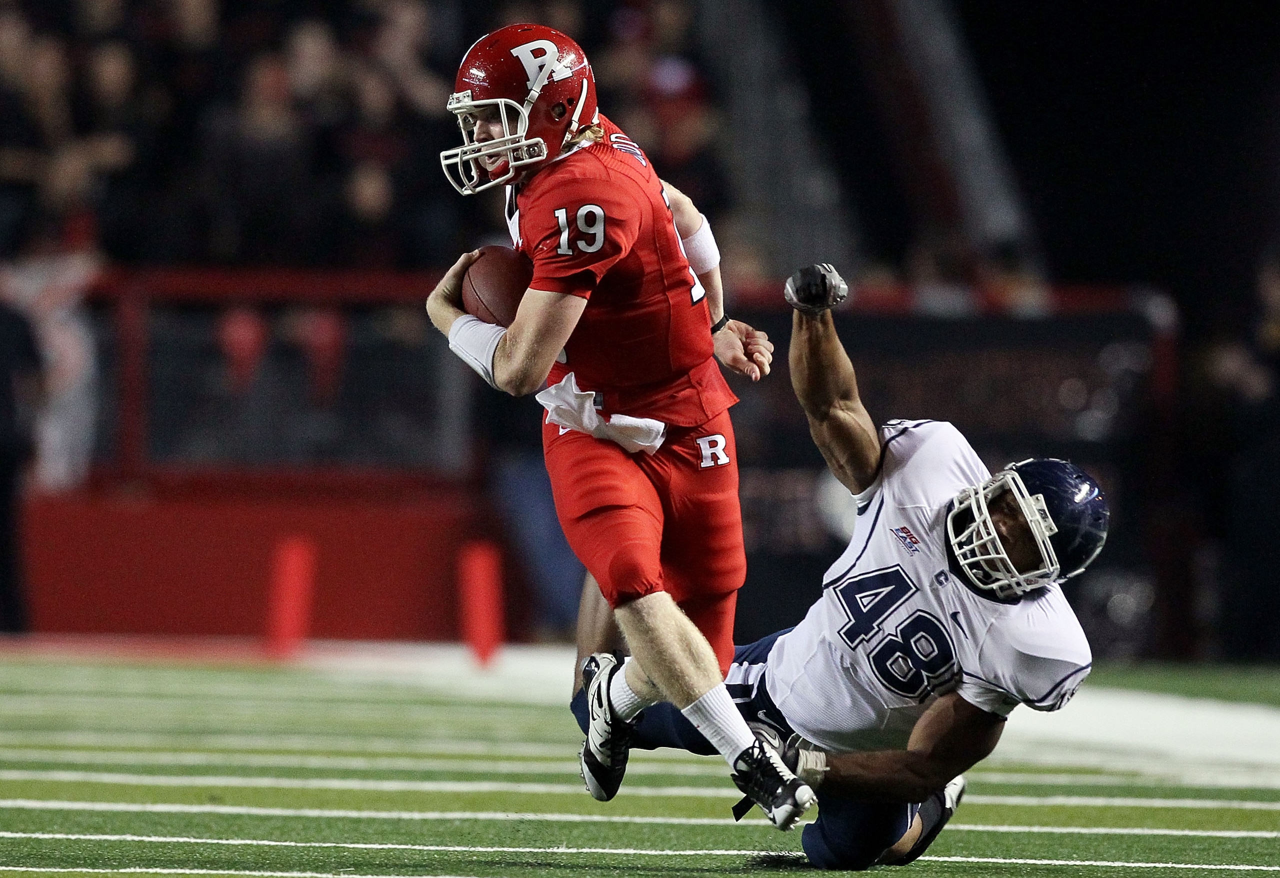 PISCATAWAY, NJ - OCTOBER 08:  Chas Dodd #19 of the Rutgers Scarlet Knights runs the ball against Trevardo Williams #48 of the Connecticut Huskies at Rutgers Stadium on October 8, 2010 in Piscataway, New Jersey.  (Photo by Jim McIsaac/Getty Images)