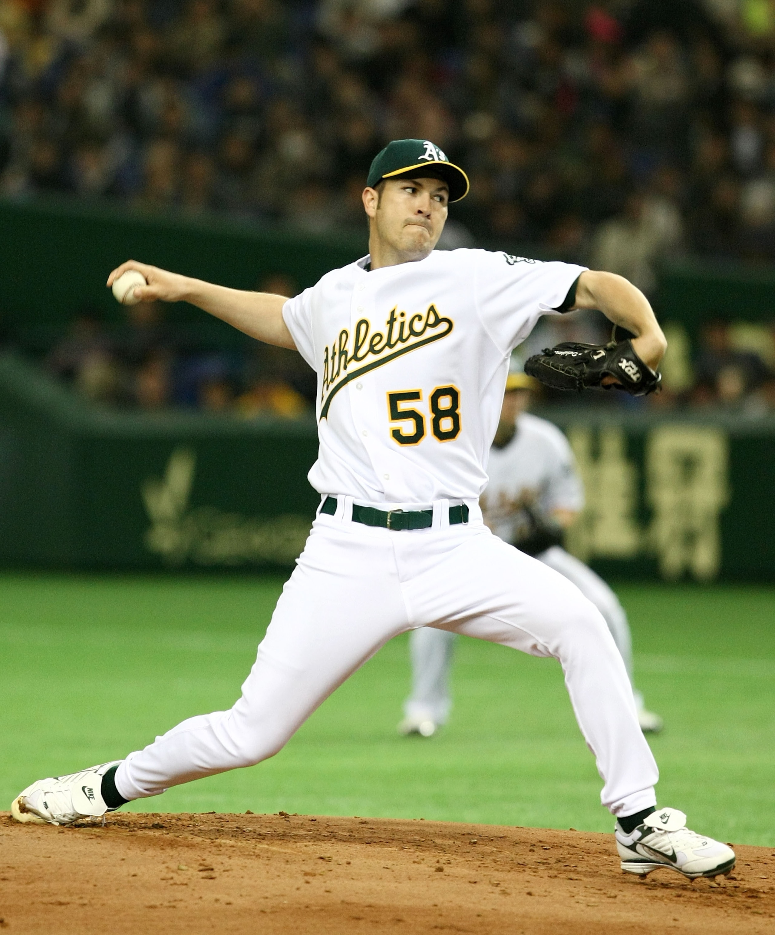 TOKYO - MARCH 23:  Justin Duchscherer #58 of Oakland Athletics pitches during a preseason friendly game between the Oakland Athletics and the Hanshin Tigers at the Tokyo Dome on March 23, 2008 in Tokyo, Japan.  (Photo by Junko Kimura/Getty Images)