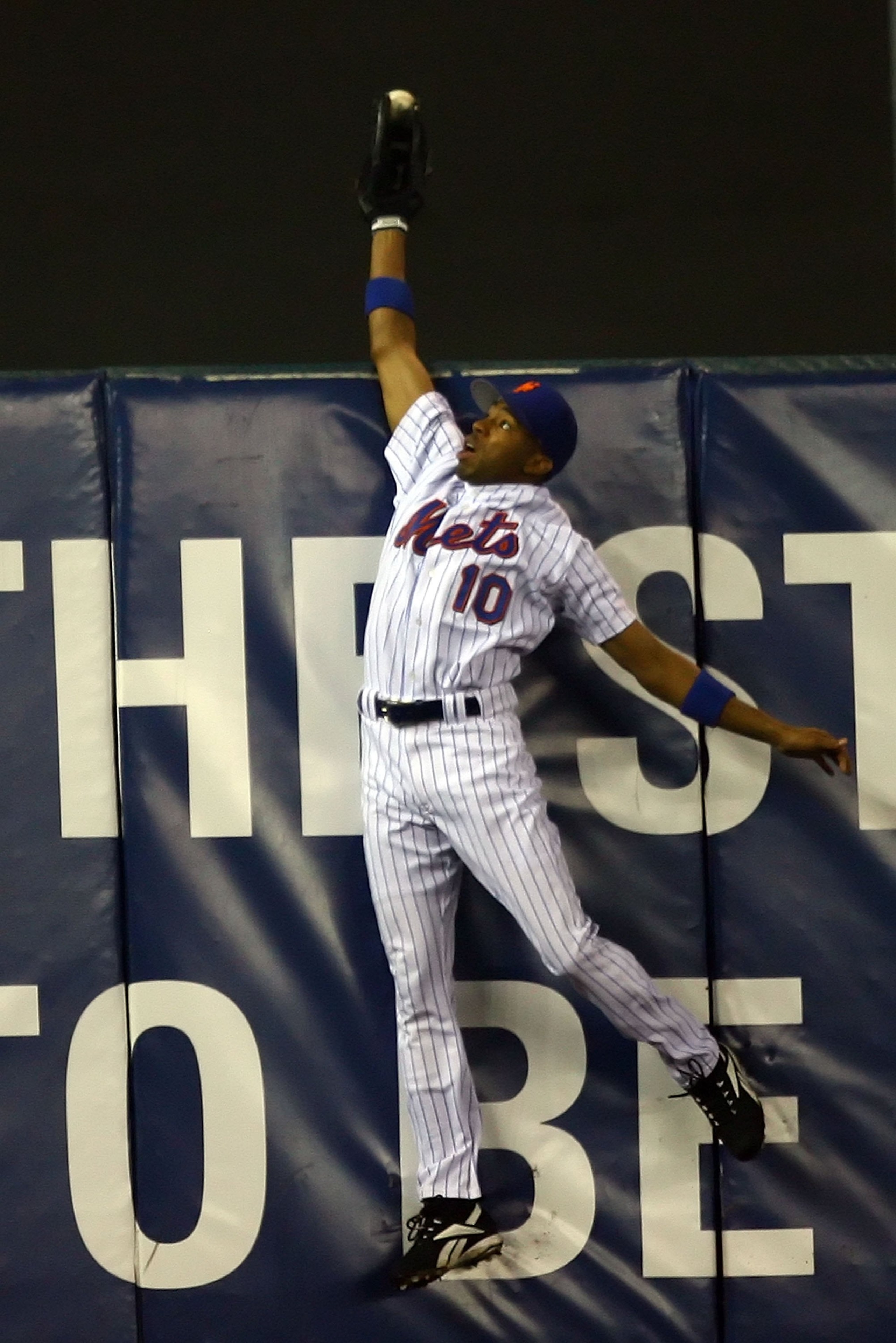 NEW YORK - OCTOBER 19: Endy Chavez #10 of the New York Mets catches a ball hit in the sixth inning hit by Scott Rolen #27 of the St. Louis Cardinals during game seven of the NLCS at Shea Stadium on October 19, 2006 in the Flushing neighborhood of the Que NEW YORK - OCTOBER 19: Endy Chavez #10 of the New York Mets catches a ball hit in the sixth inning hit by Scott Rolen #27 of the St. Louis Cardinals during game seven of the NLCS at Shea Stadium on October 19, 2006 in the Flushing neighborhood of the Que