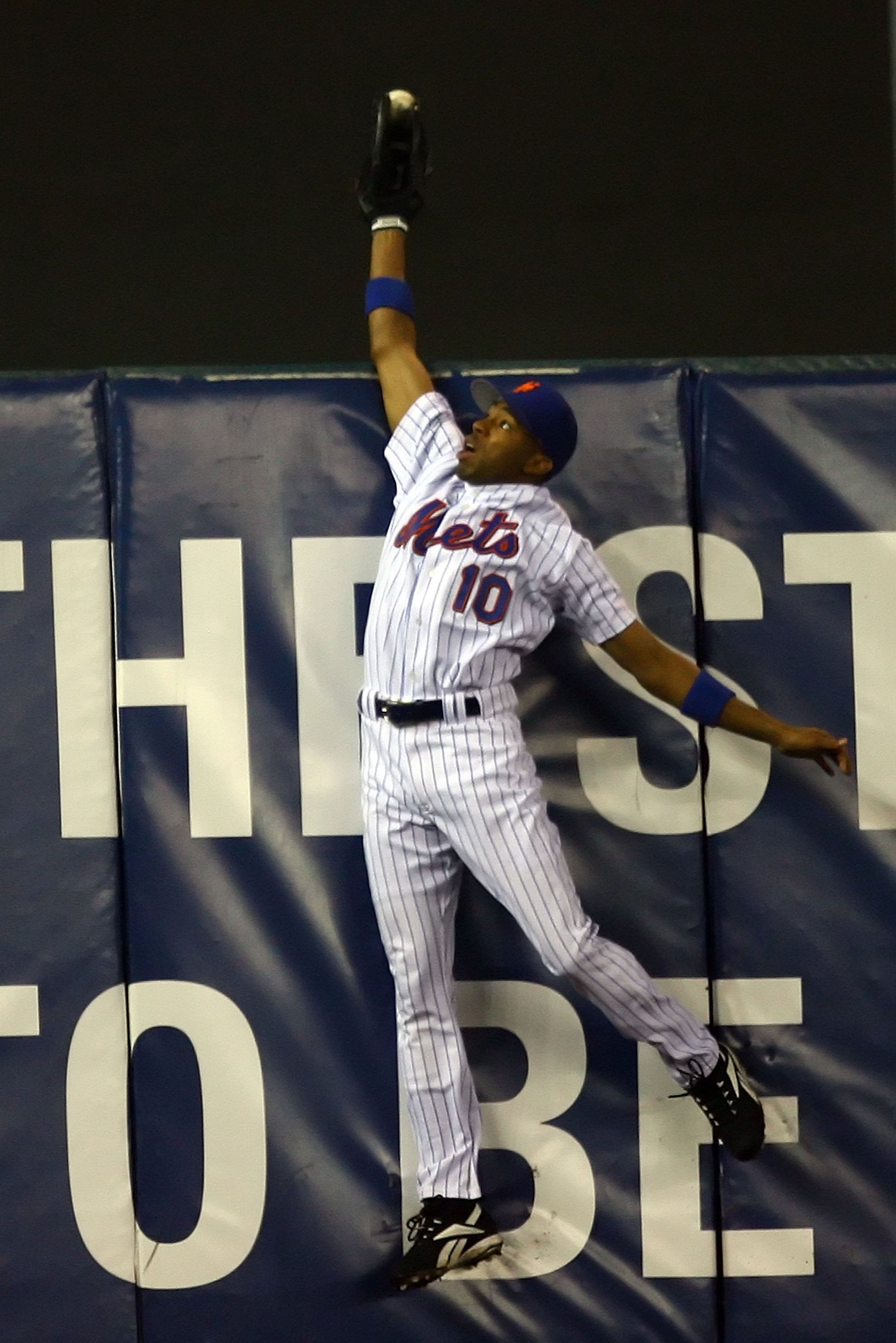 NEW YORK - OCTOBER 19: Endy Chavez #10 of the New York Mets catches a ball hit in the sixth inning hit by Scott Rolen #27 of the St. Louis Cardinals during game seven of the NLCS at Shea Stadium on October 19, 2006 in the Flushing neighborhood of the Que NEW YORK - OCTOBER 19: Endy Chavez #10 of the New York Mets catches a ball hit in the sixth inning hit by Scott Rolen #27 of the St. Louis Cardinals during game seven of the NLCS at Shea Stadium on October 19, 2006 in the Flushing neighborhood of the Que