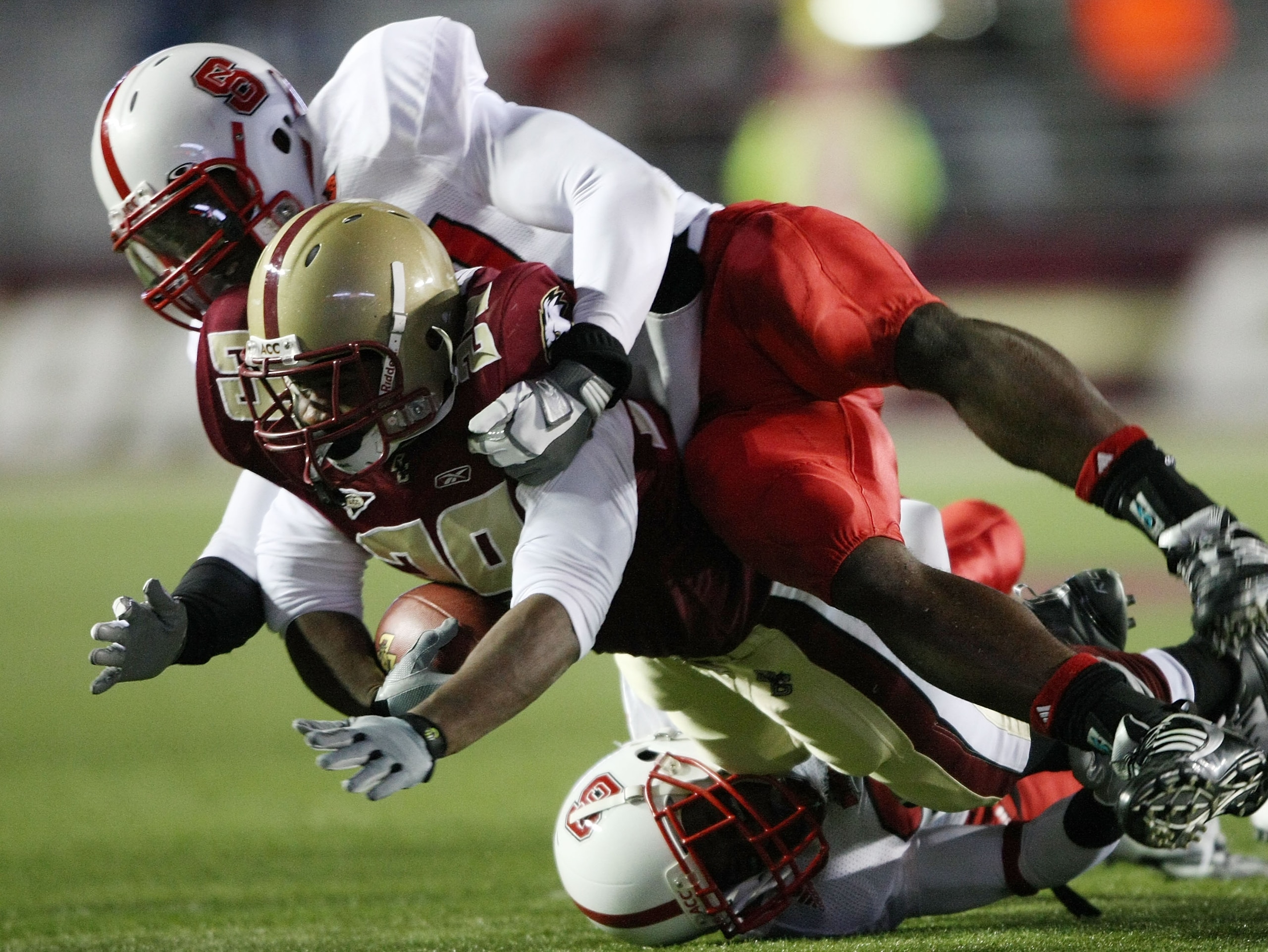 CHESTNUT HILL, MA - OCTOBER 17:  Rolandan Finch #29 of the Boston College Eagles is tackled by DeAndre Morgan #21 of the North Carolina State Wolf Pack makes the tackle on October 17, 2009 at Alumni Stadium in Chestnut Hill, Massachusetts.  (Photo by Elsa