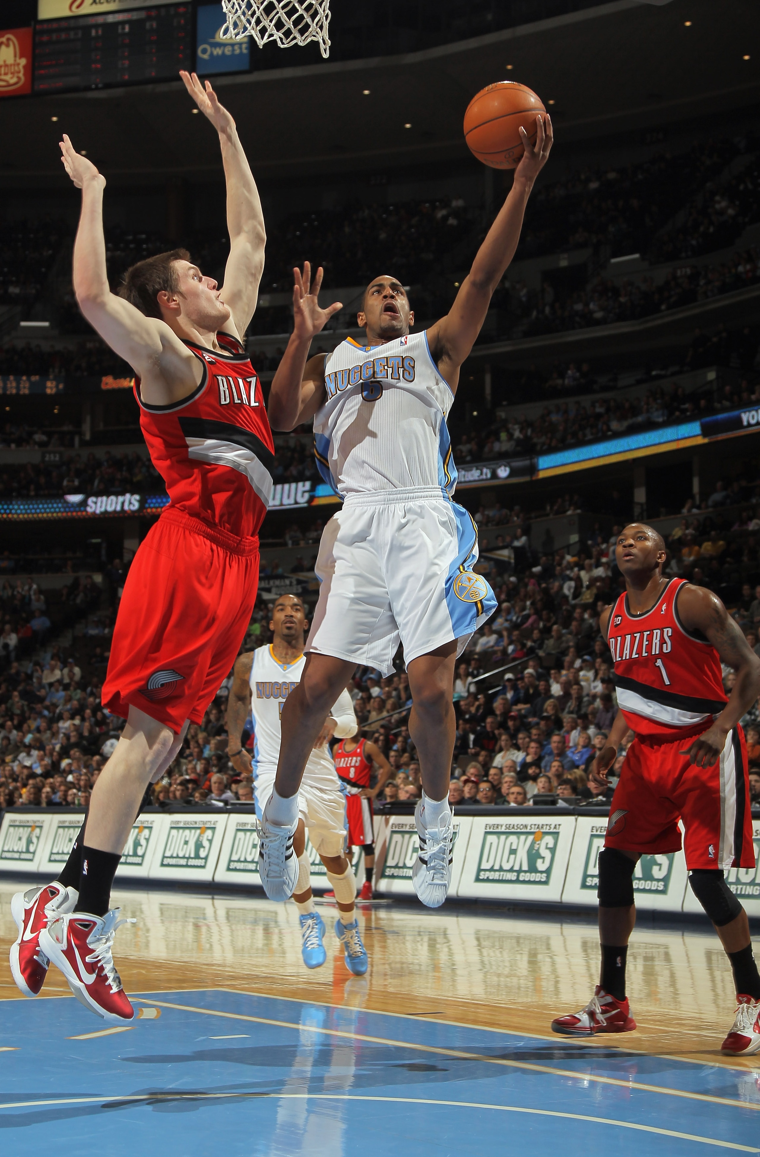 DENVER - DECEMBER 28:  Arron Afflalo #6 of the Denver Nuggets lays up a shot around the defense of Luke Babbit #11 of the Portland Trail Blazers at Pepsi Center on December 28, 2010 in Denver, Colorado. The Nuggets defeated the Blazers 95-77. NOTE TO USER