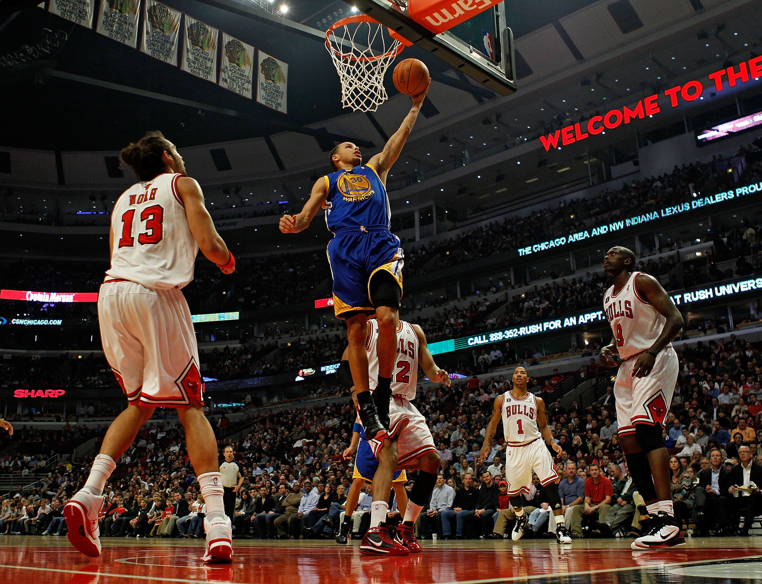 CHICAGO - NOVEMBER 11: Stephen Curry #30 of the Golden State Warriors drives to the basket surrounded by Joakim Noah #13, Taj Gibson #22, Derrick Rose #1 and Loul Deng #9 of the Chicago Bulls at the United Center on November 11, 2010 in Chicago, Illinois. CHICAGO - NOVEMBER 11: Stephen Curry #30 of the Golden State Warriors drives to the basket surrounded by Joakim Noah #13, Taj Gibson #22, Derrick Rose #1 and Loul Deng #9 of the Chicago Bulls at the United Center on November 11, 2010 in Chicago, Illinois.