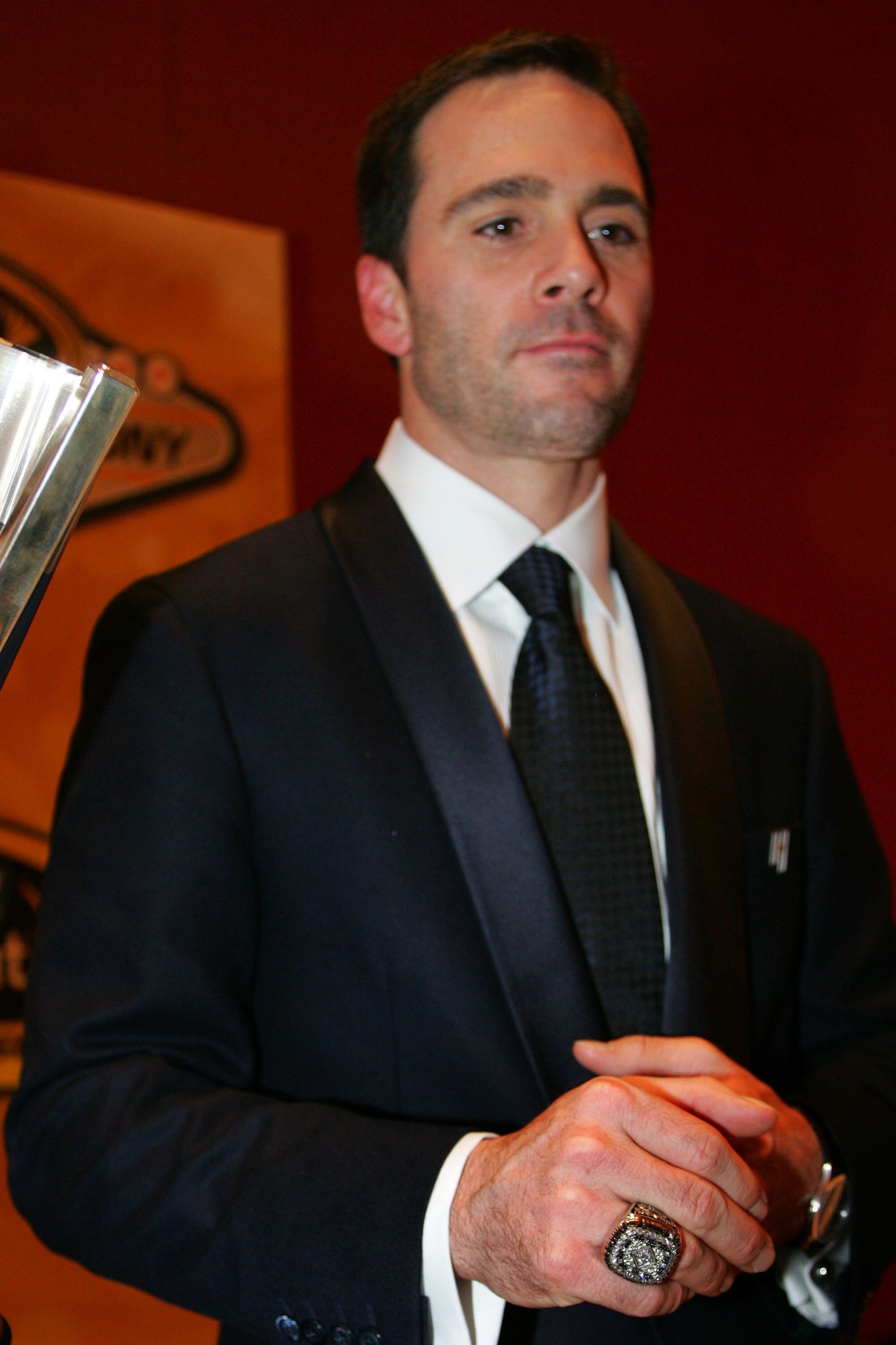 LAS VEGAS - DECEMBER 04:  Four time NASCAR Sprint Cup Series Champion Jimmie Johnson poses next to his trophy after the NASCAR Sprint Cup Series awards banquet during the final day of the NASCAR Sprint Cup Series Champions Week on December 4, 2009 in Las