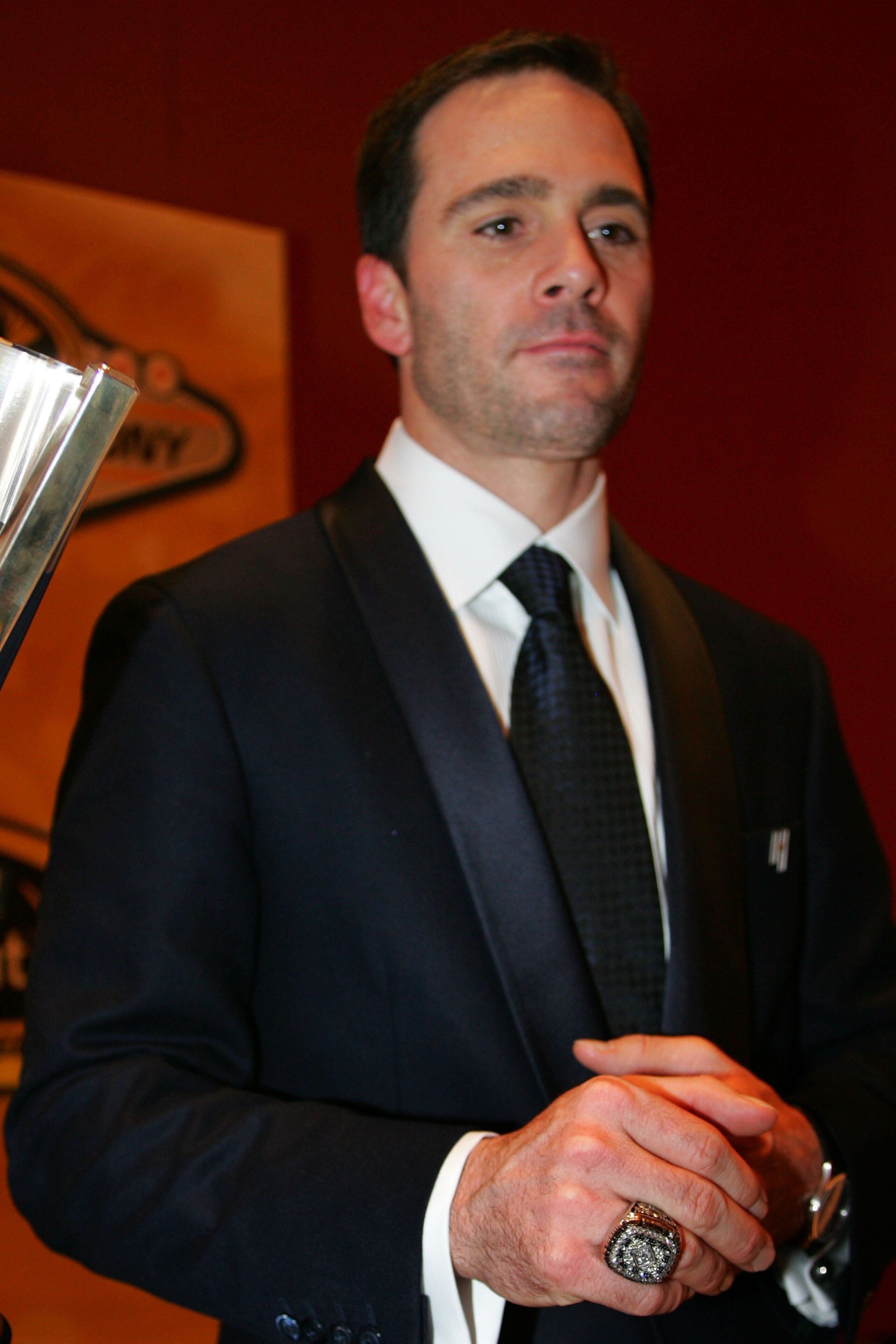 LAS VEGAS - DECEMBER 04:  Four time NASCAR Sprint Cup Series Champion Jimmie Johnson poses next to his trophy after the NASCAR Sprint Cup Series awards banquet during the final day of the NASCAR Sprint Cup Series Champions Week on December 4, 2009 in Las
